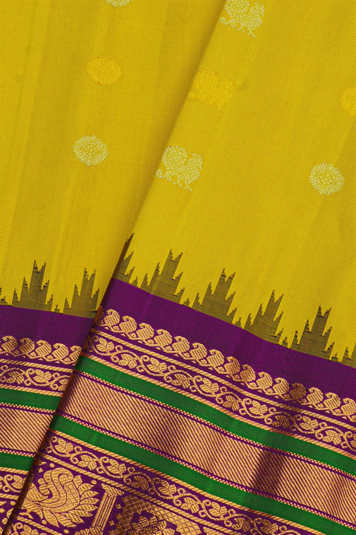 Gadwal Silk Yellow Saree With Peacock And Floral Buttis Body