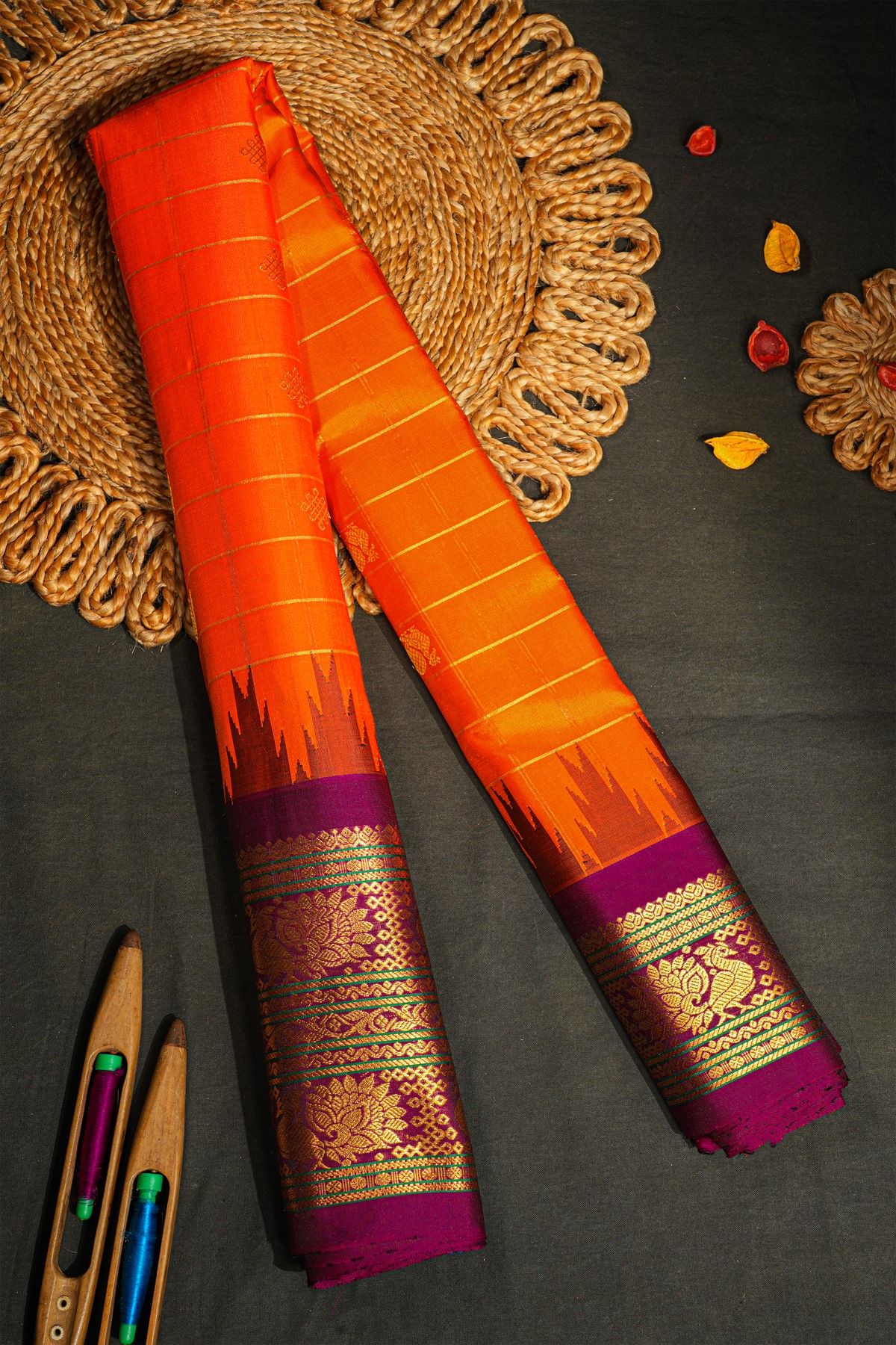 Gadwal Silk Orange Saree With Florals And Peacocks Border