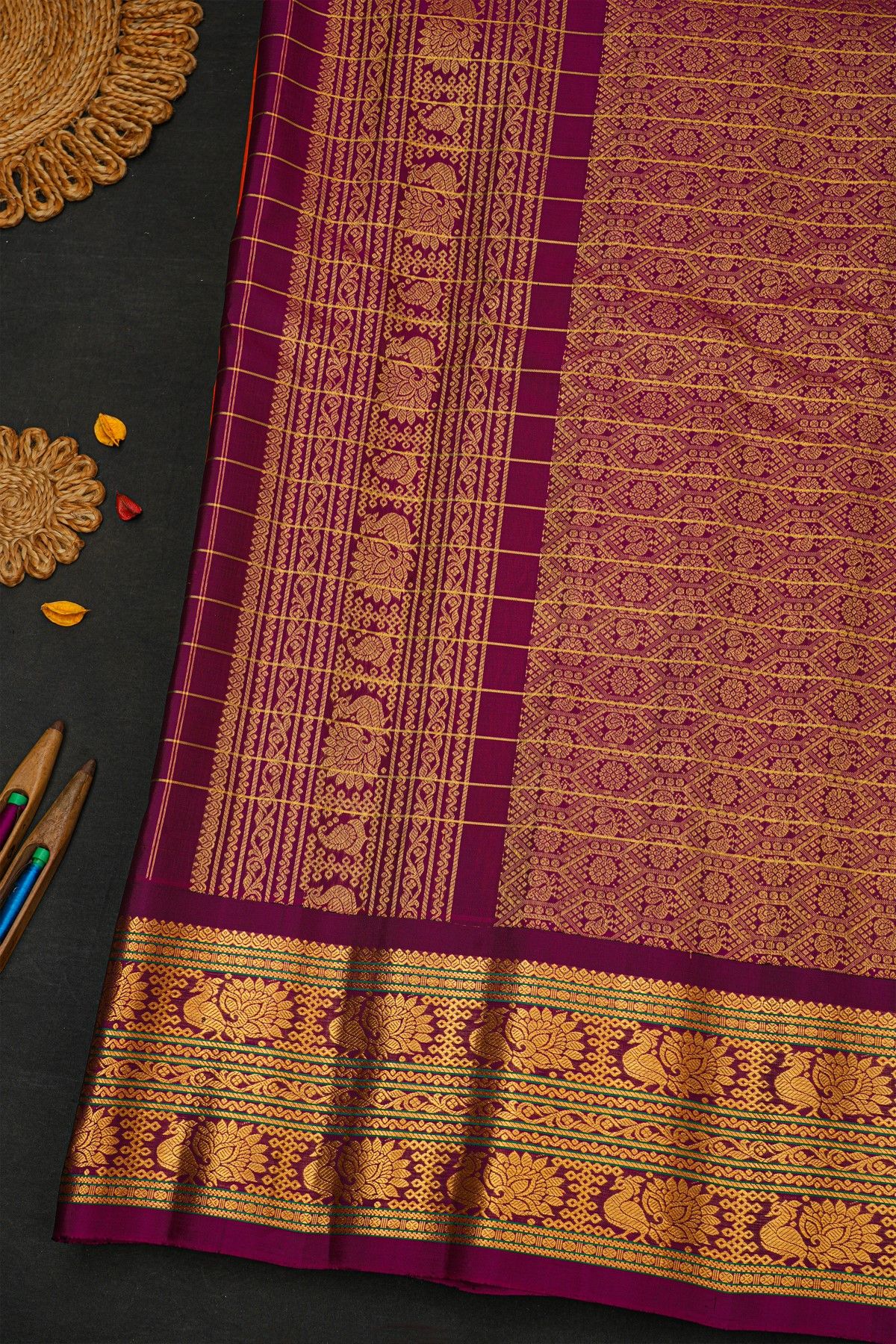 Gadwal Silk Orange Saree With Florals And Peacocks Border