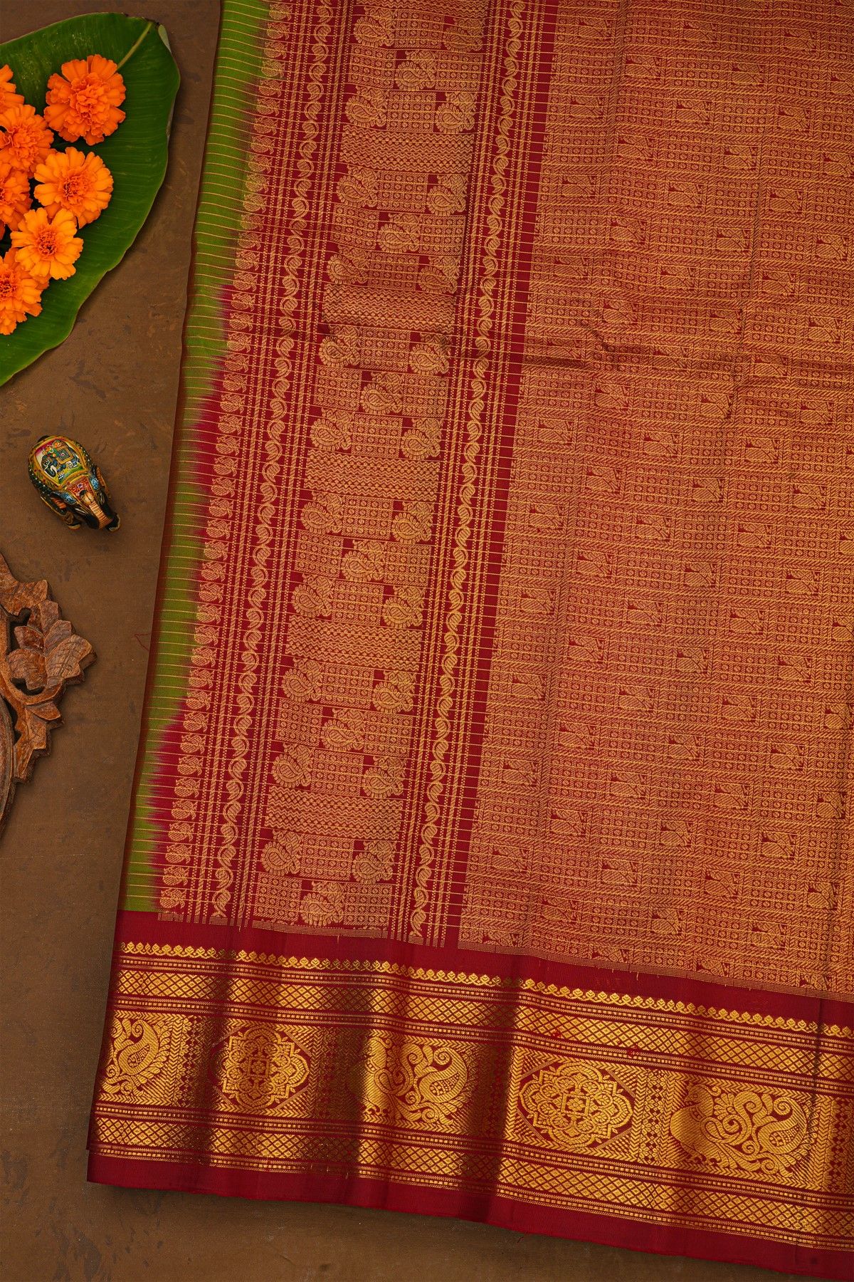 Gadwal Silk Leaf Green Saree With Florals And Peacock Contrast Border