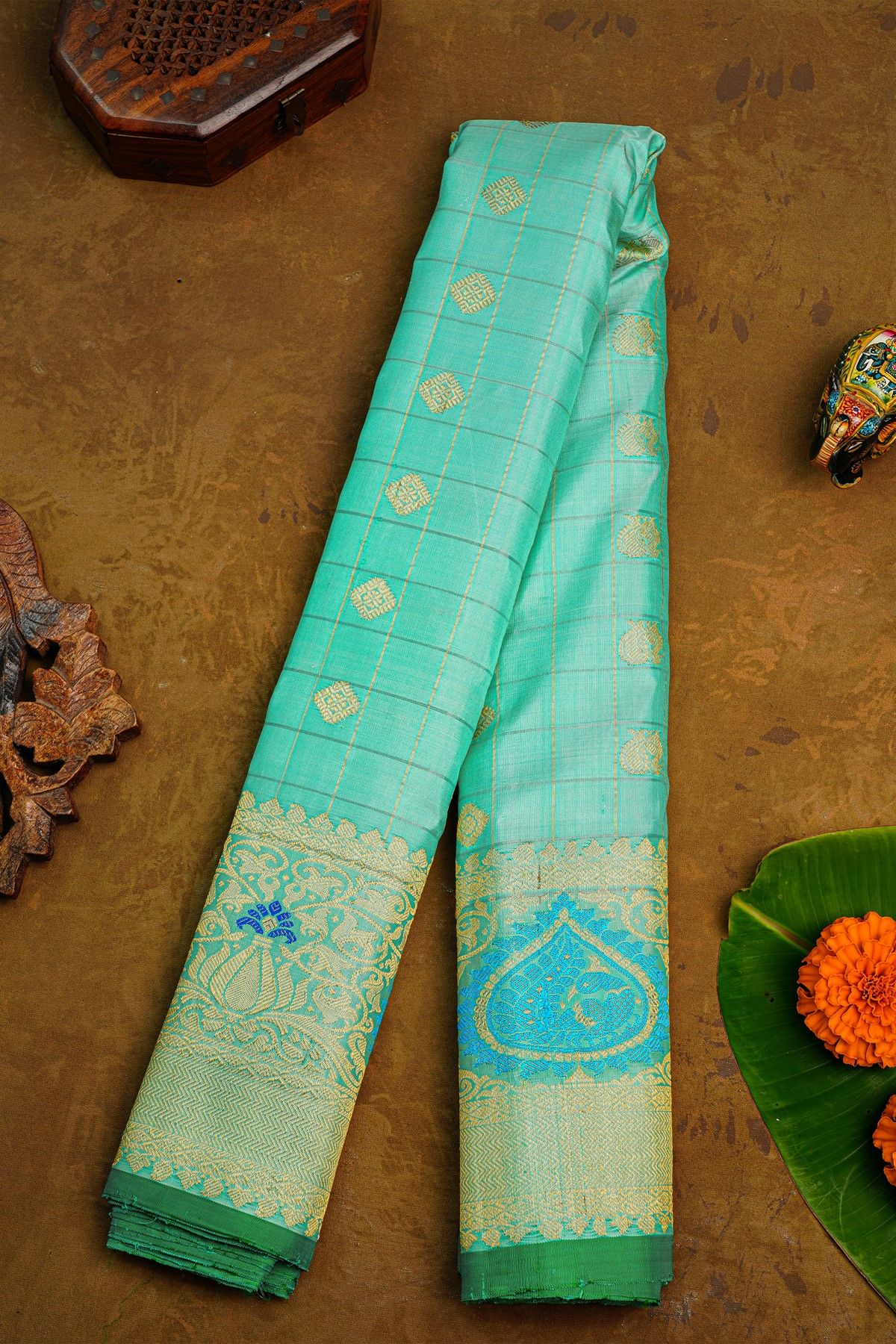 Gadwal Silk Mint Green Saree With Florals And Peacock Body