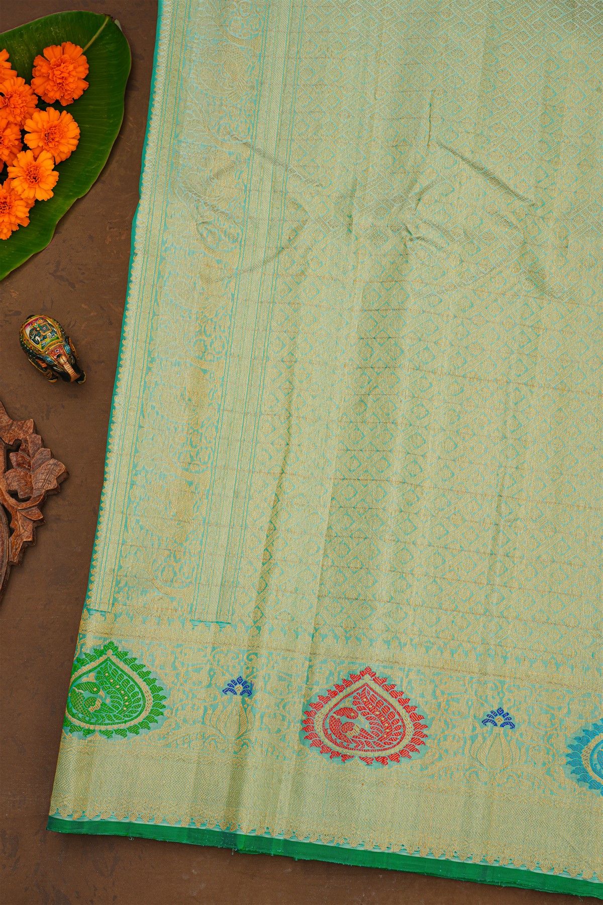 Gadwal Silk Mint Green Saree With Florals And Peacock Body