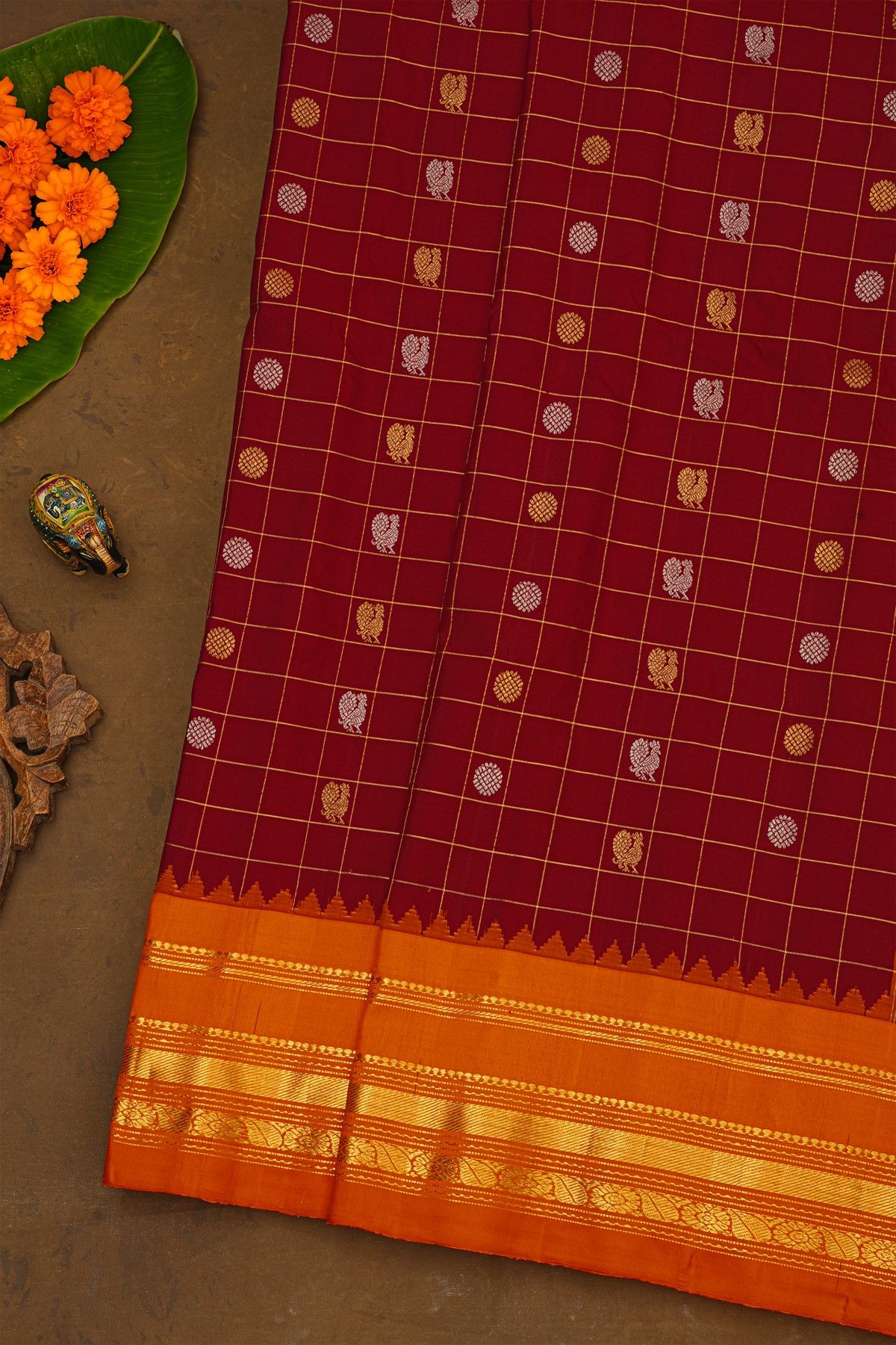 Gadwal Silk Maroon Saree With Florals In Zari Checks And Contrast Border
