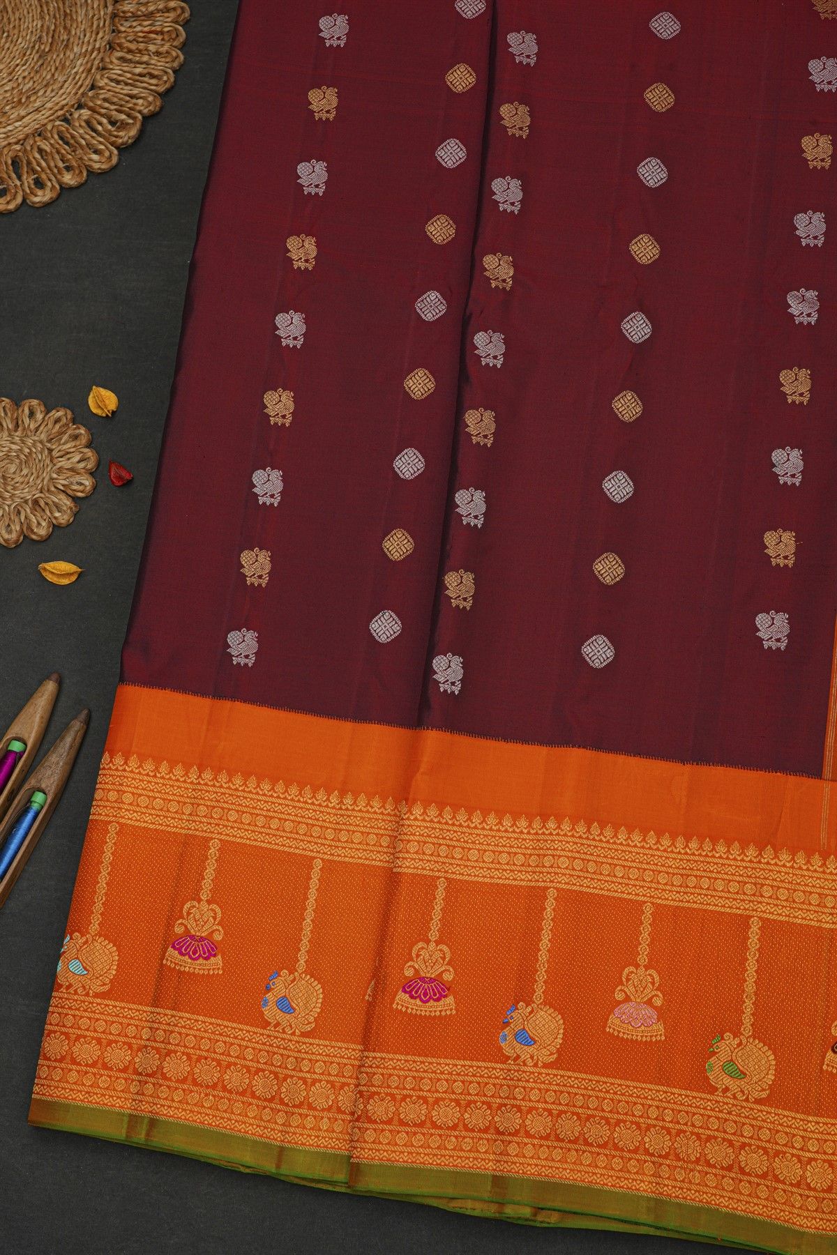 Gadwal Silk Dark Maroon Saree With Florals And Peacock Buttis Body