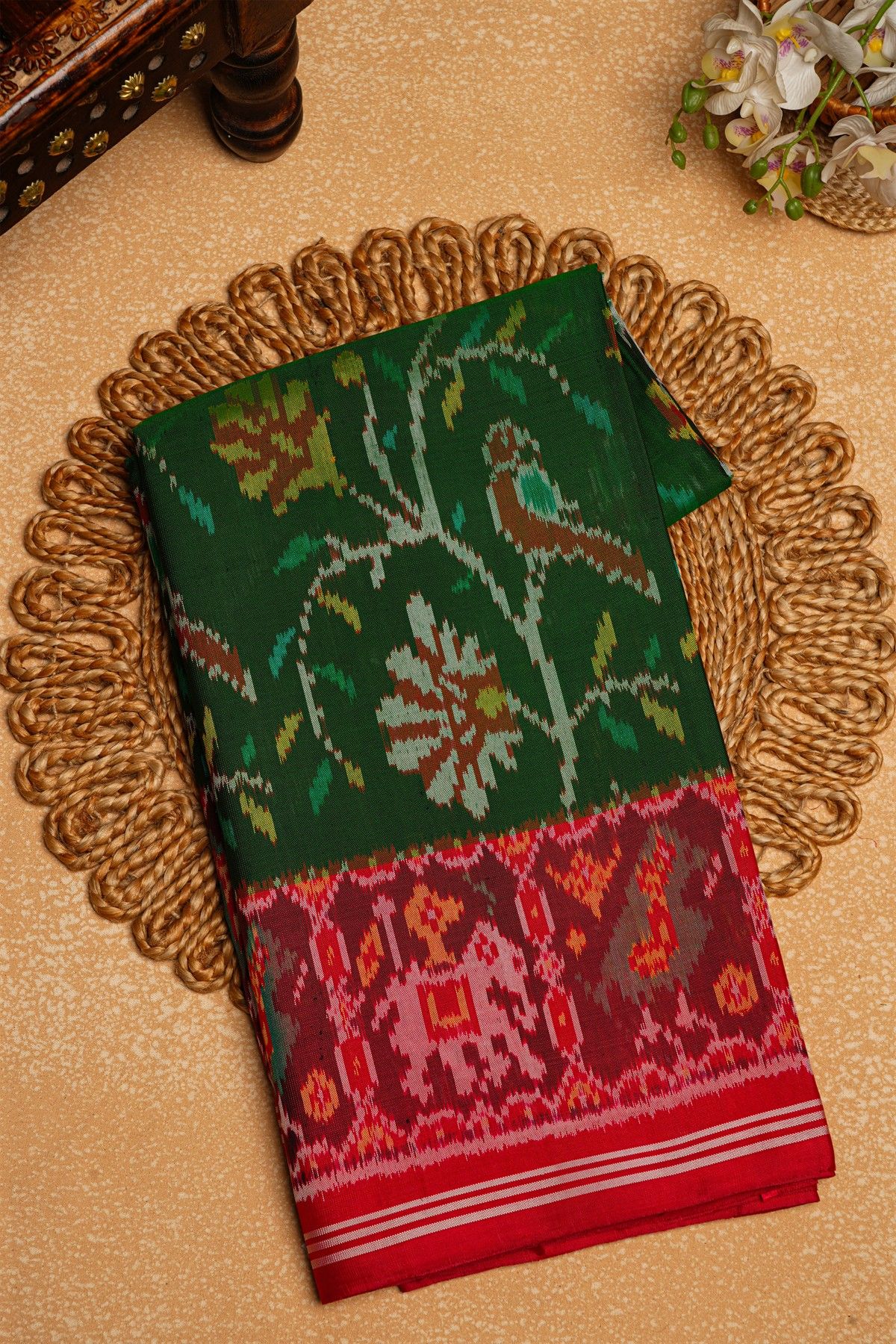 Patola Silk Parrot Green Saree With Florals And Leaves Body And Contrast Florals And Leaves With Animals Border