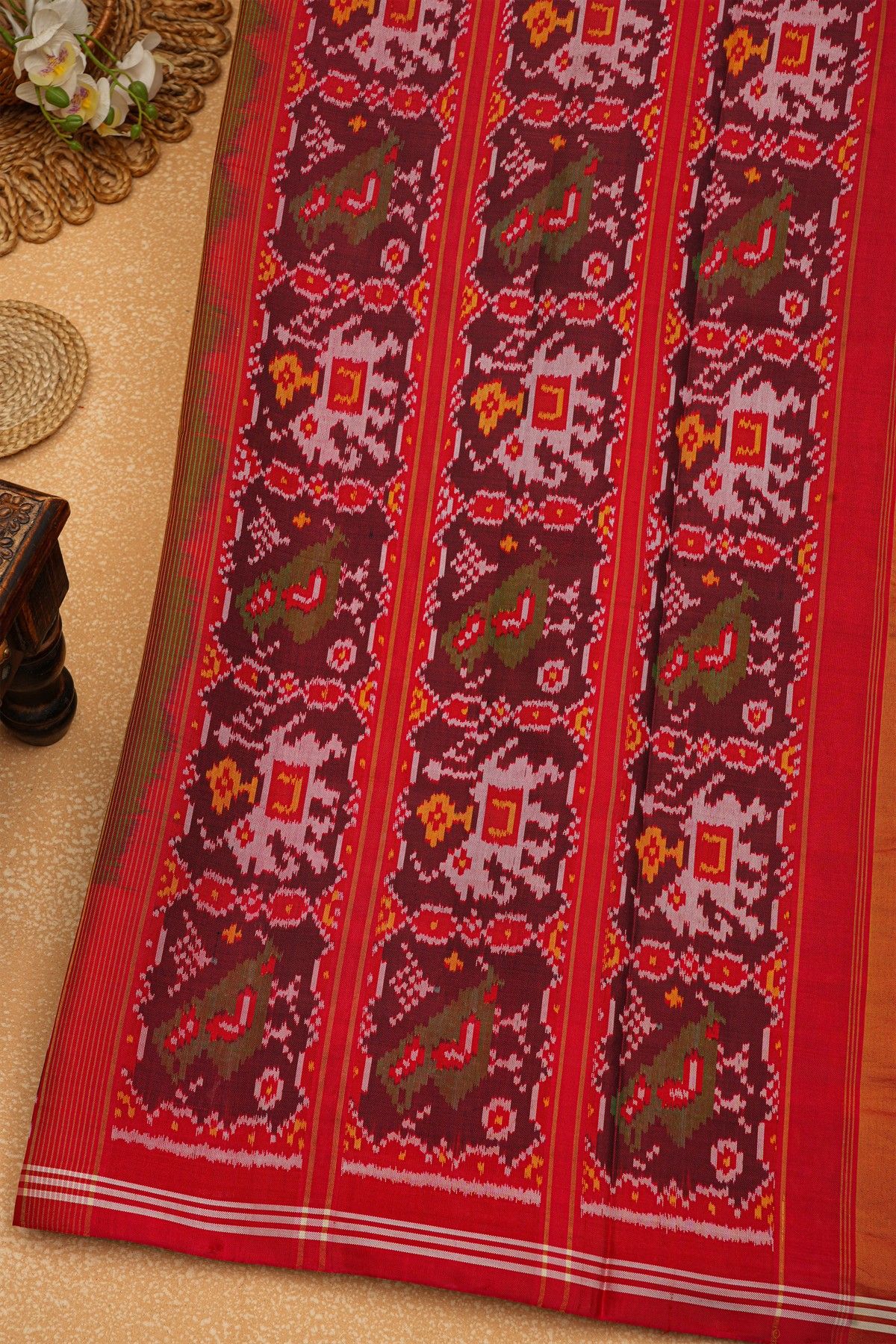 Patola Silk Parrot Green Saree With Florals And Leaves Body And Contrast Florals And Leaves With Animals Border