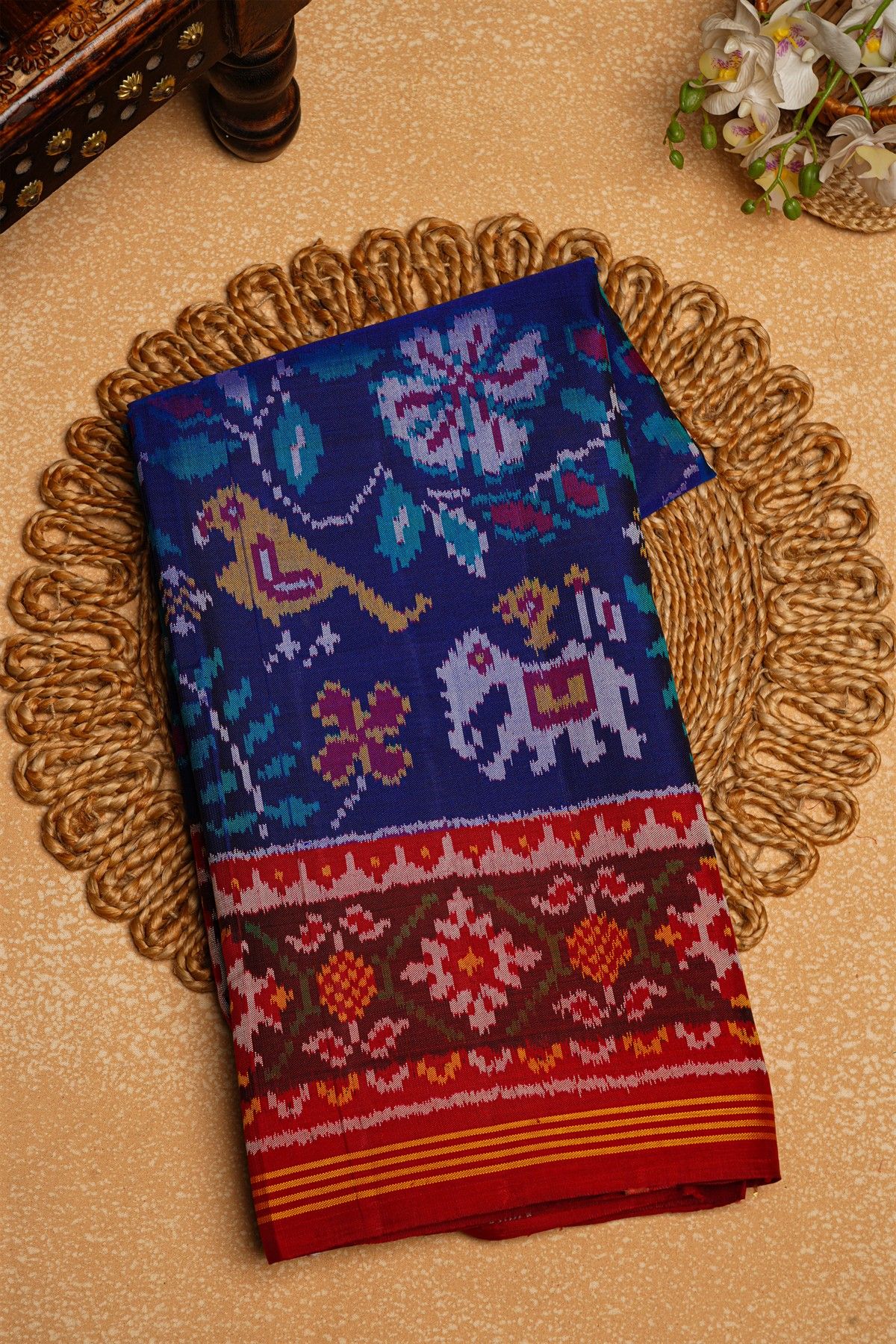 Patola Silk Maroon Saree With Florals And Leaves Body And Self Florals And Leaves Border