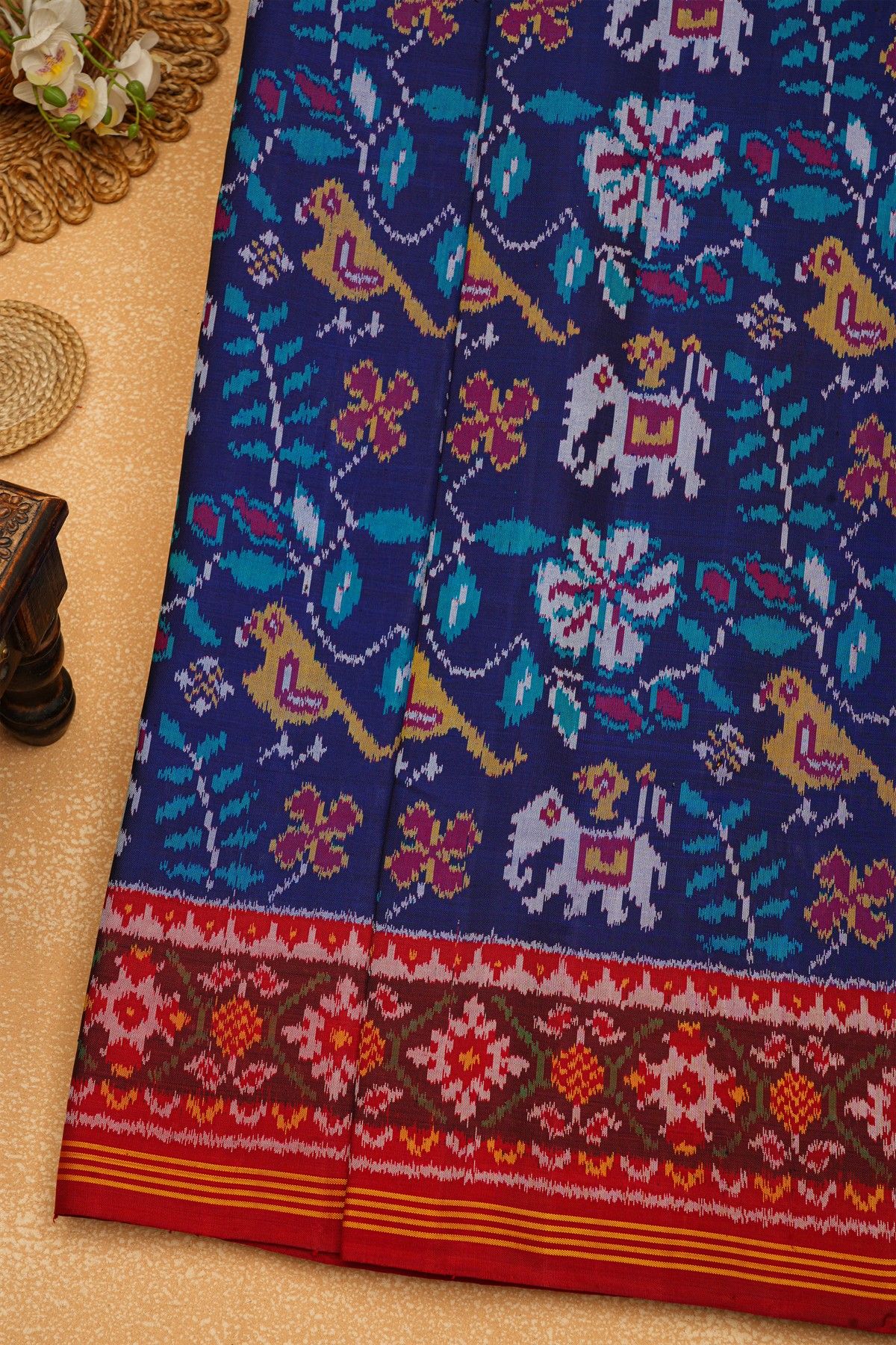 Patola Silk Maroon Saree With Florals And Leaves Body And Self Florals And Leaves Border