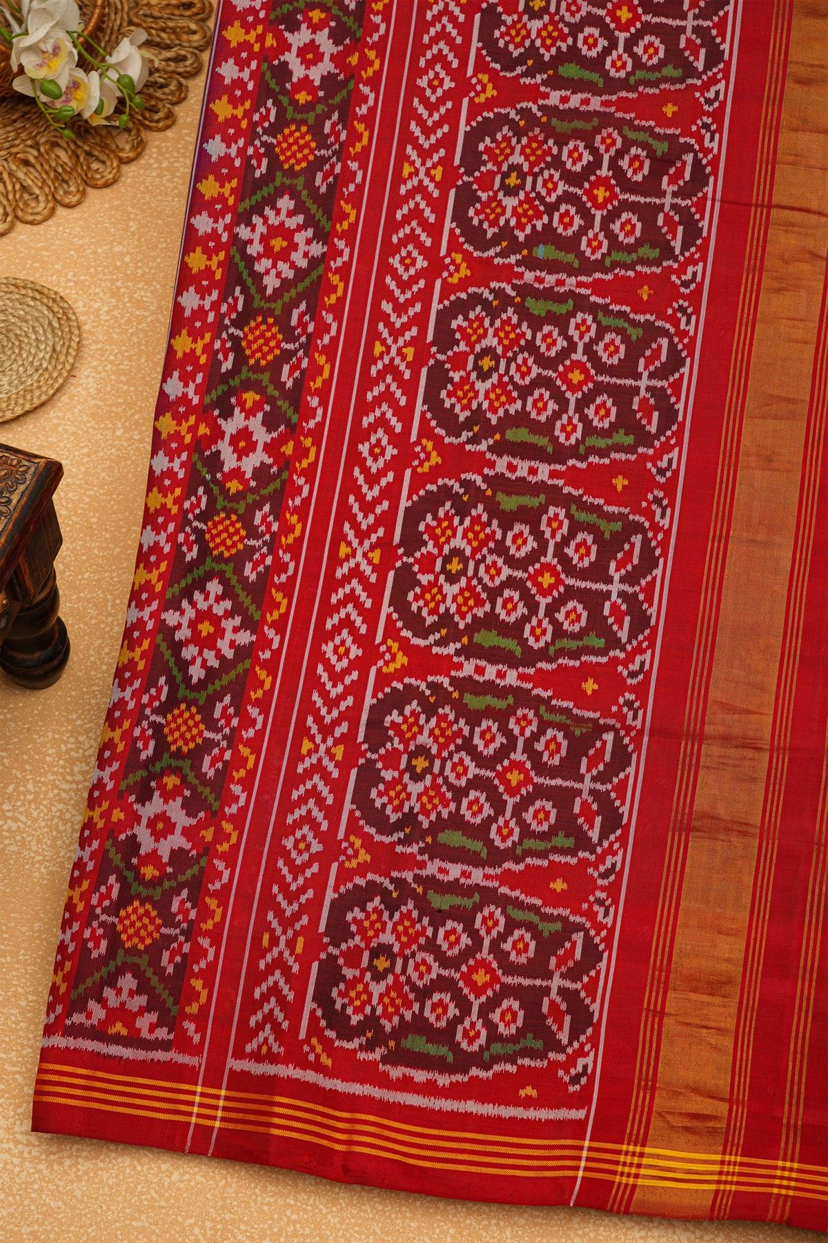 Patola Silk Maroon Saree With Florals And Leaves Body And Self Florals And Leaves Border