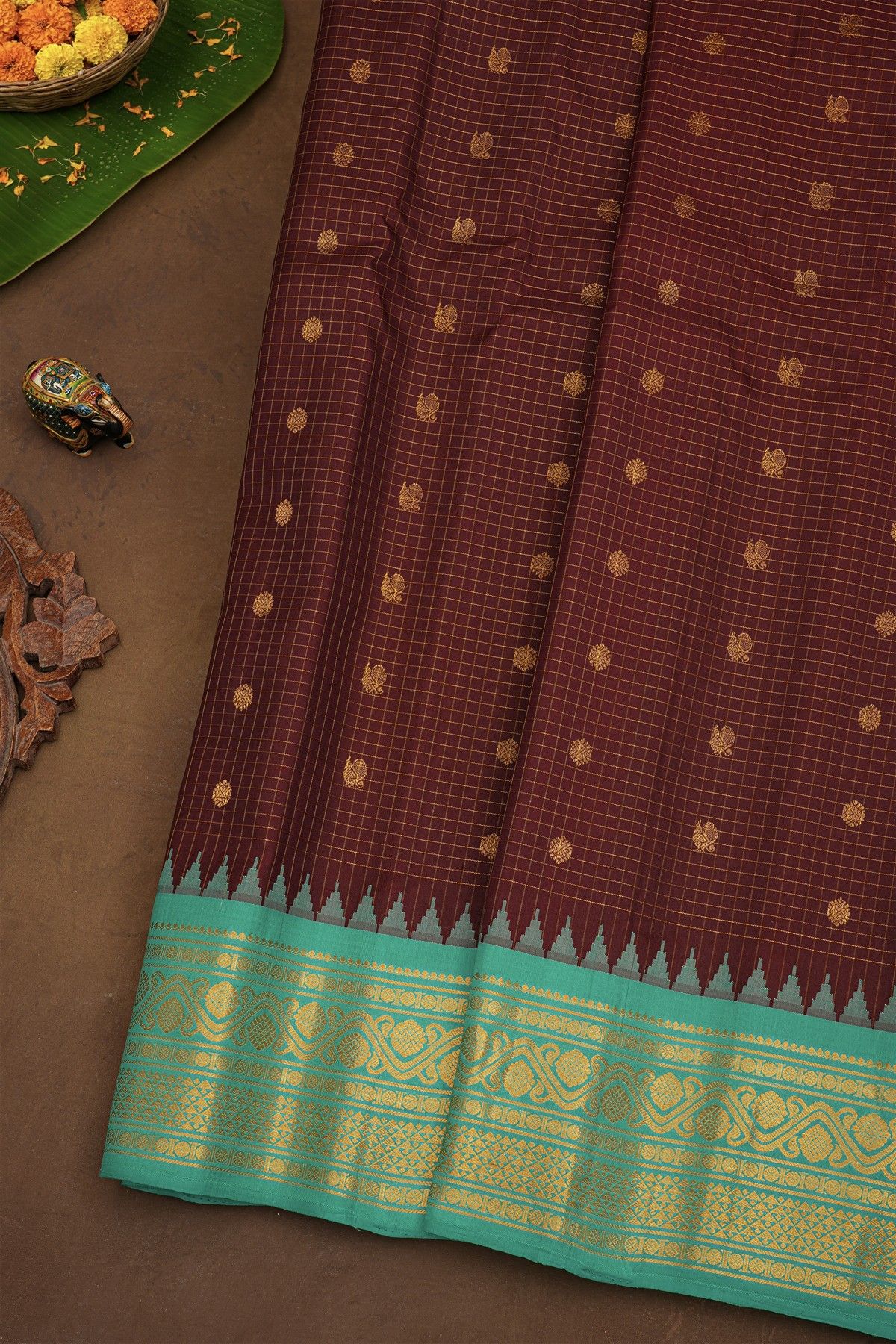 Gadwal Silk Maroon Saree With Florals And Peacocks In Zari Checks