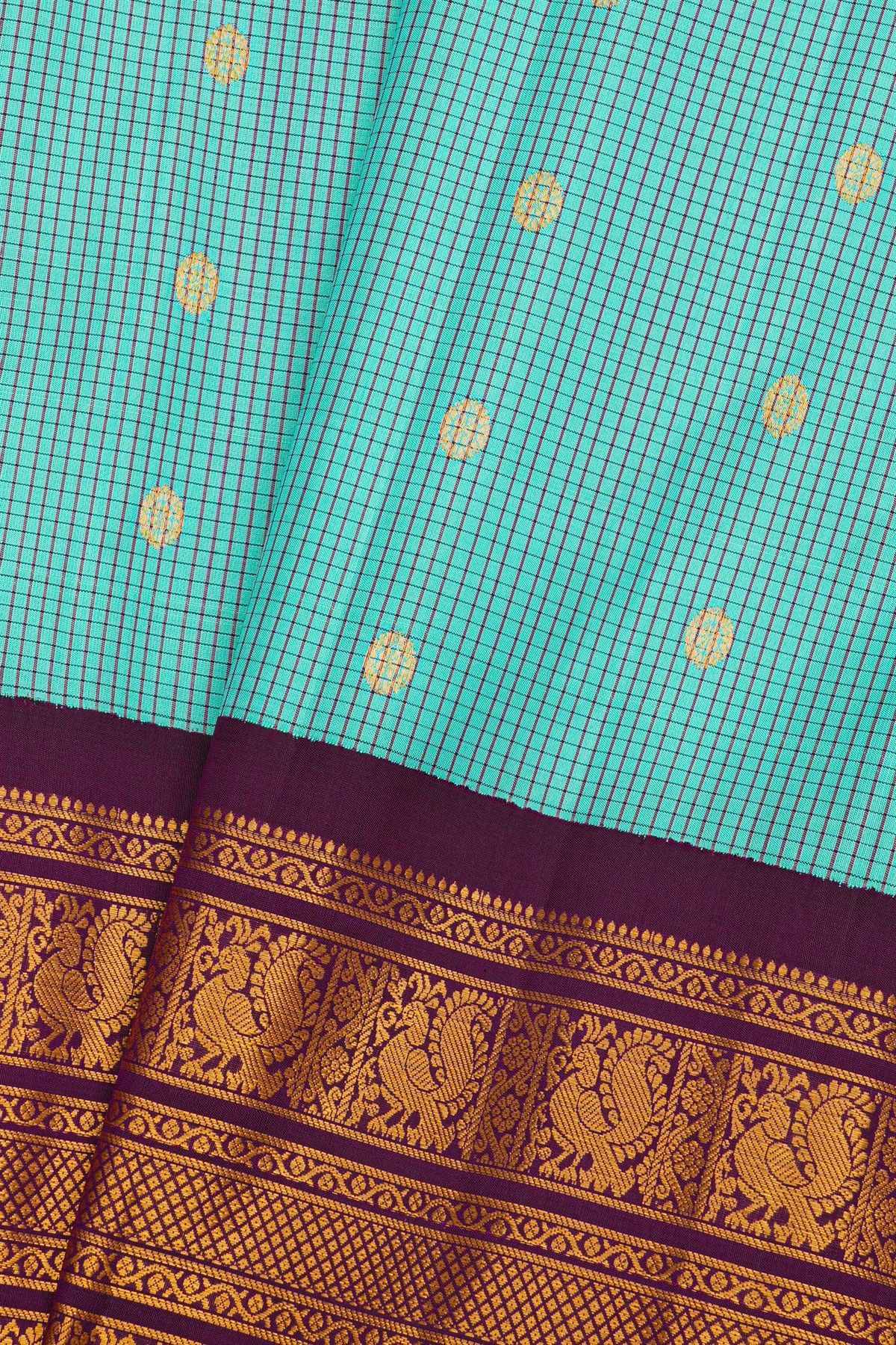 Gadwal Silk Sky Blue Saree With Rudraksha Buttis Body And Peacock Buttis Contrast Border