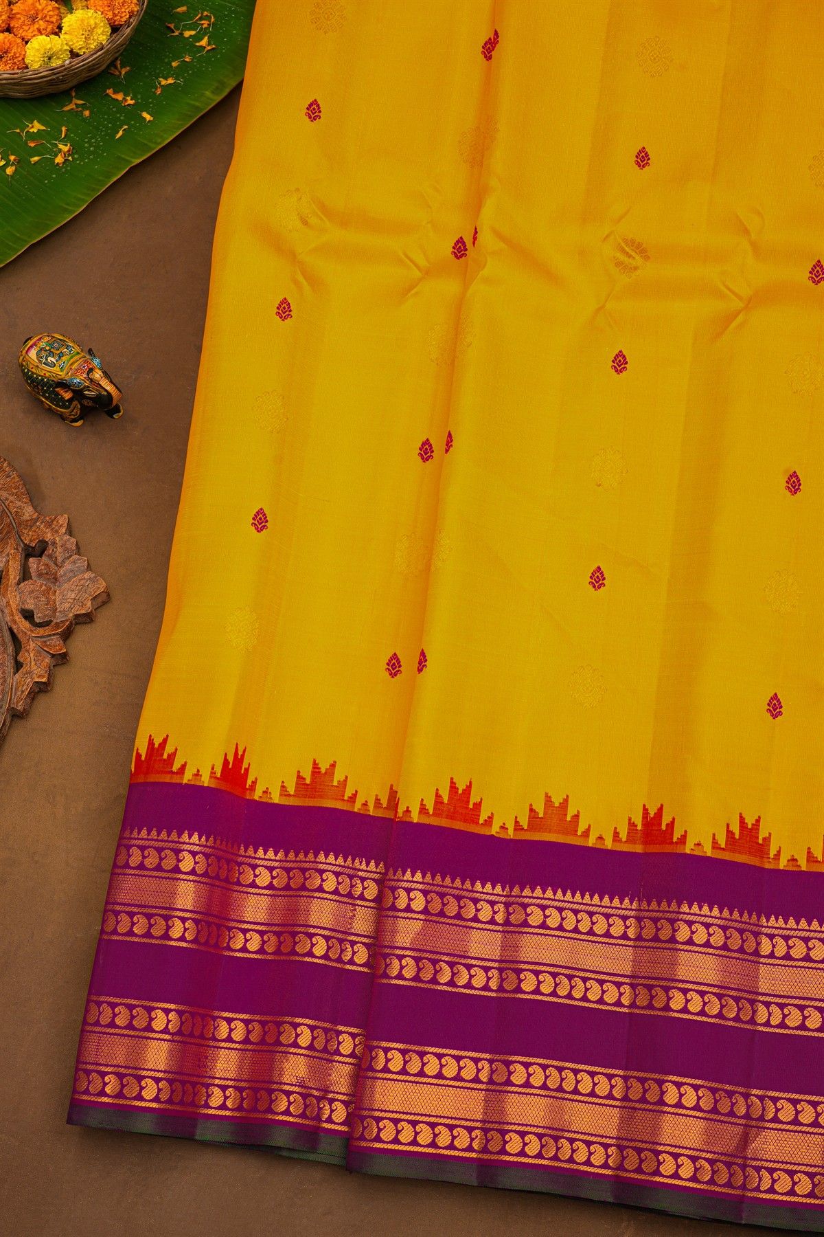 Gadwal Silk Yellow Saree With Buttis Body And Contrast Mango Paisley Border