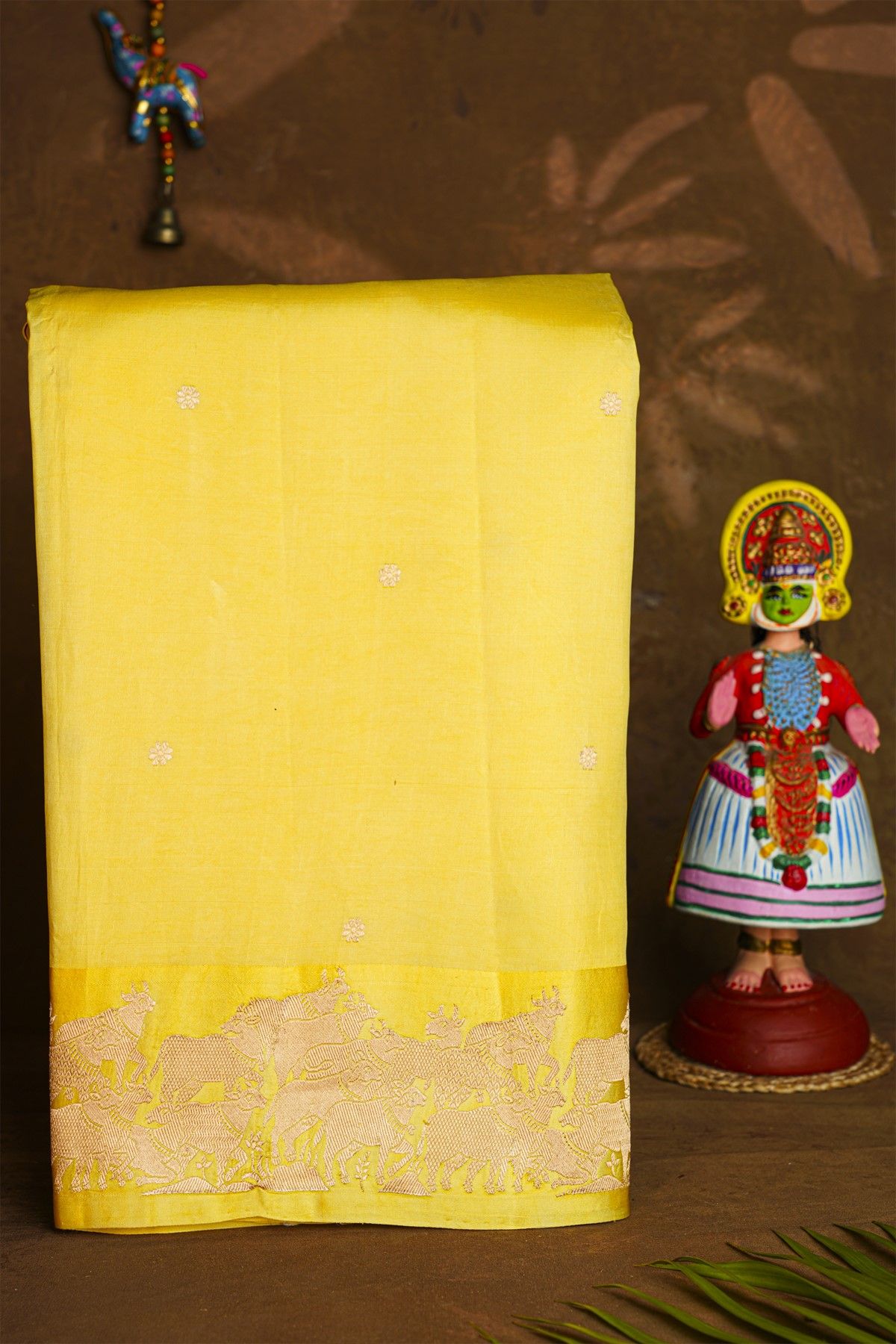 Fancy Matka Silk Yellow Saree With Floral Buttis Body And Pichwai Cows Motifs Border