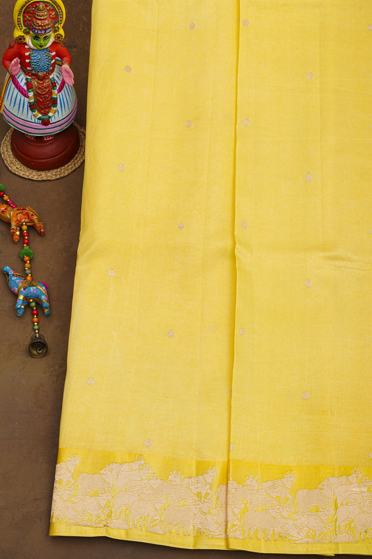 Fancy Matka Silk Yellow Saree With Floral Buttis Body And Pichwai Cows Motifs Border