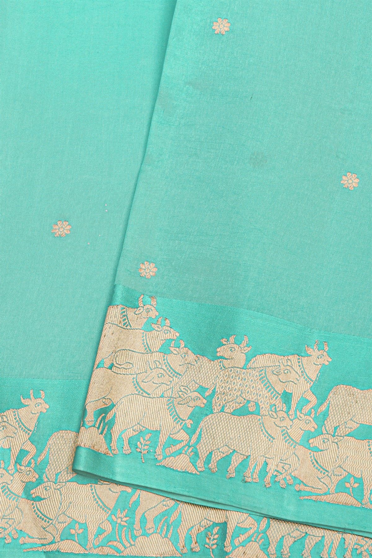 Fancy Matka Silk Sky Blue Saree With Floral Buttis Body And Pichwai Cows Motifs Border