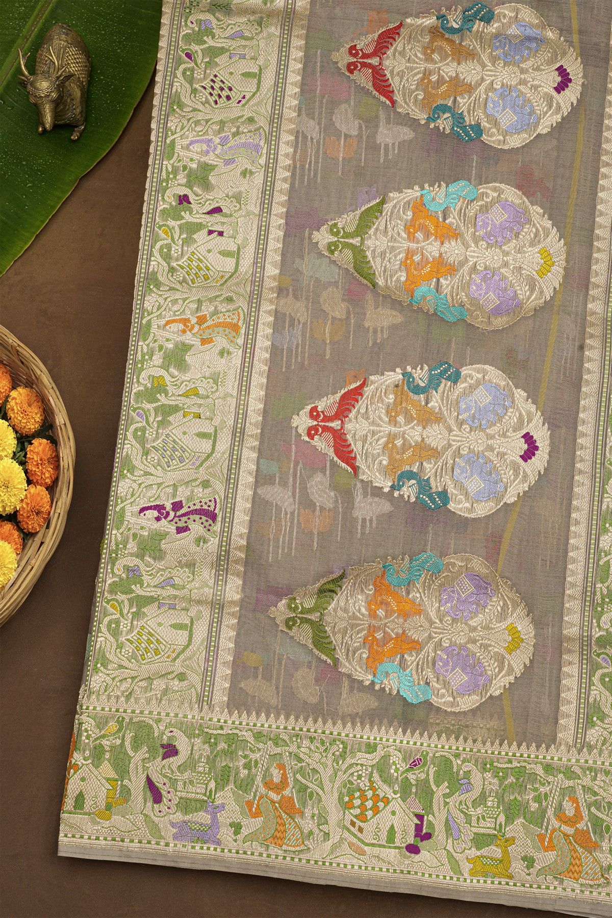 Banarasi Kora Grey Saree With Florals And Human Motifs Border