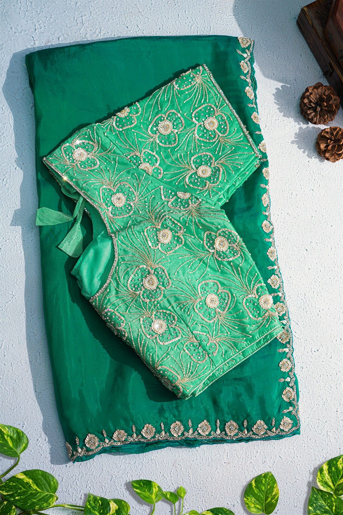 Banarasi Georgette Bottle Green Saree With Florals And Leaves Border