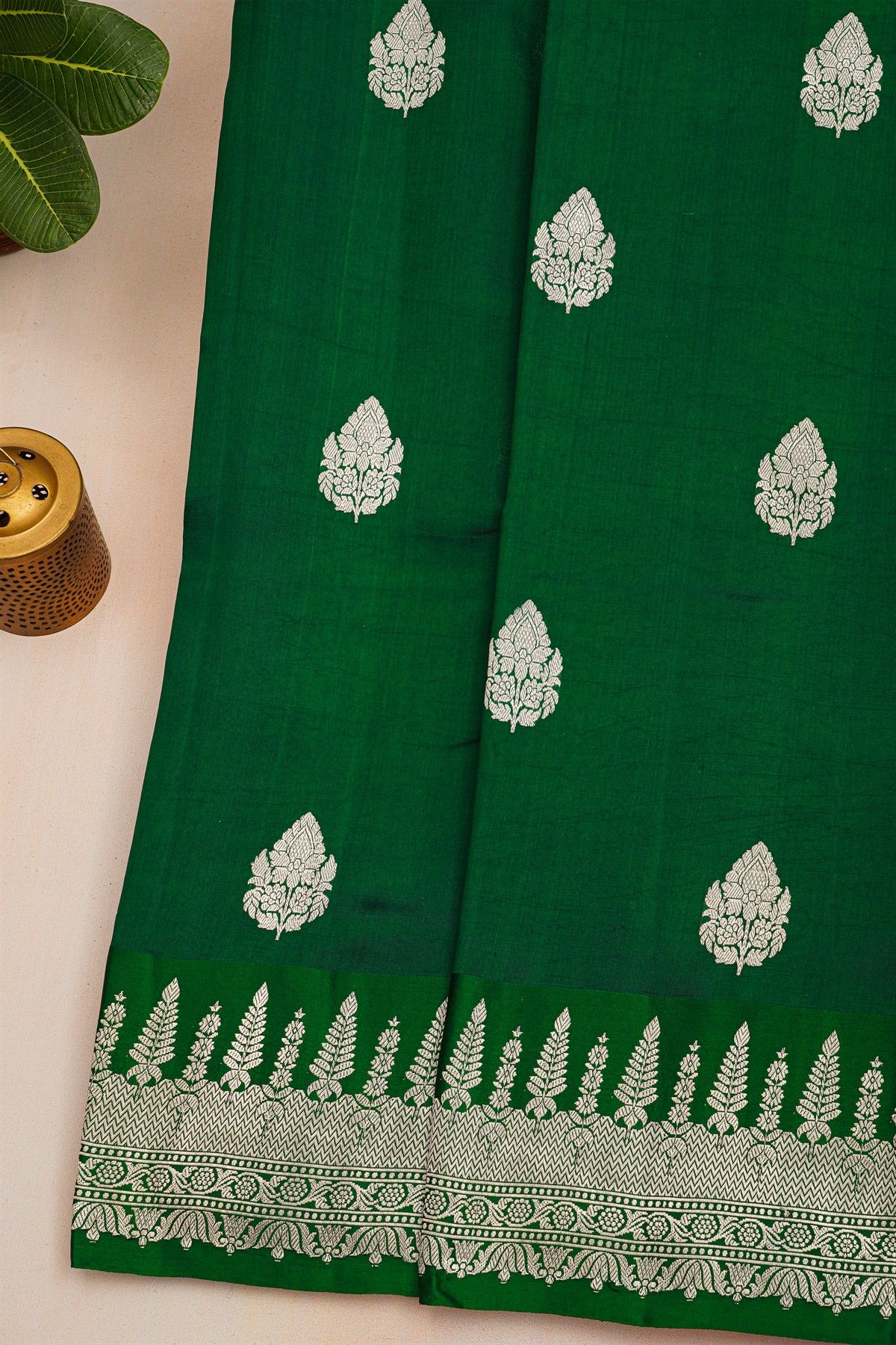 Fancy Matka Silk Bottle Green Saree With Florals And Buttis Body And Self Florals And Leaves Border