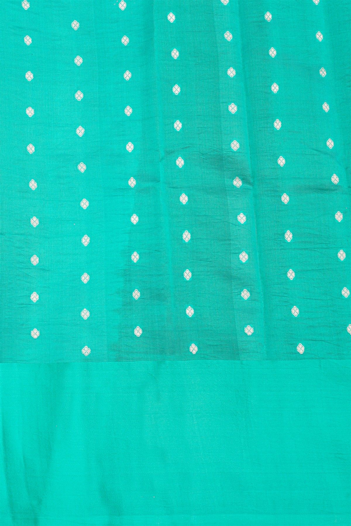 Fancy Matka Silk Bottle Green Saree With Florals And Buttis Body And Self Florals And Leaves Border