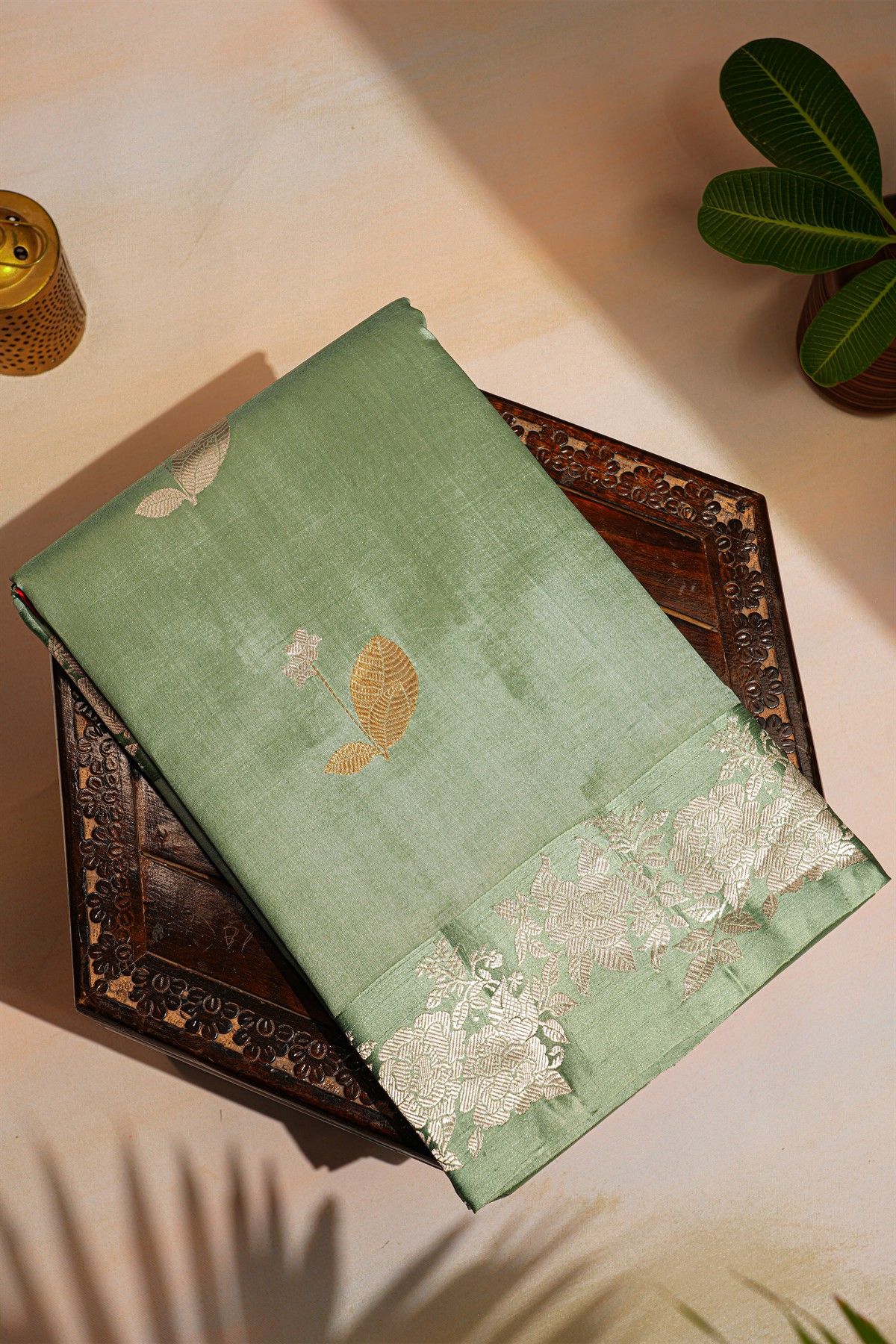 Fancy Matka Silk Sage Green Saree With Florals And Buttis Body And Self Florals And Leaves Border