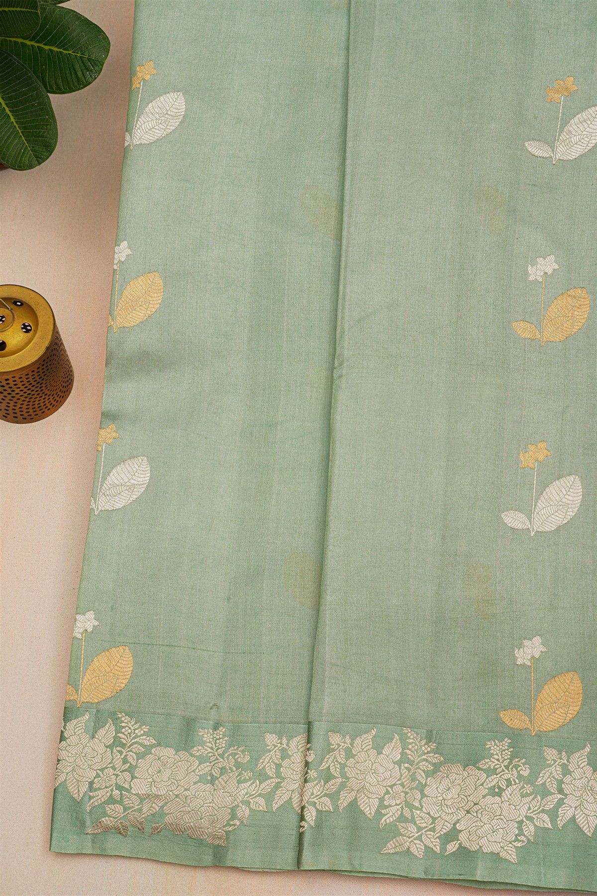 Fancy Matka Silk Sage Green Saree With Florals And Buttis Body And Self Florals And Leaves Border
