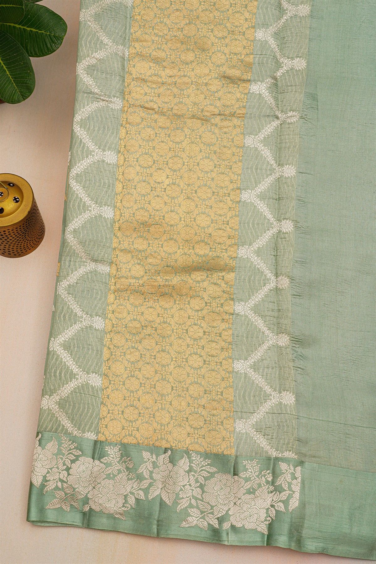 Fancy Matka Silk Sage Green Saree With Florals And Buttis Body And Self Florals And Leaves Border
