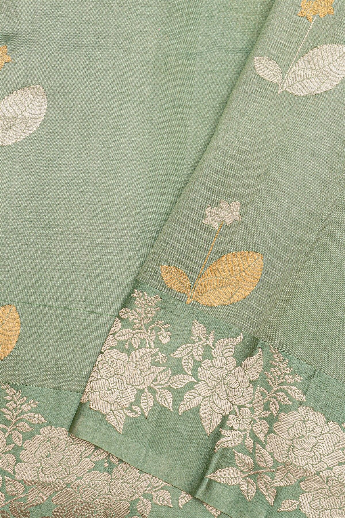 Fancy Matka Silk Sage Green Saree With Florals And Buttis Body And Self Florals And Leaves Border