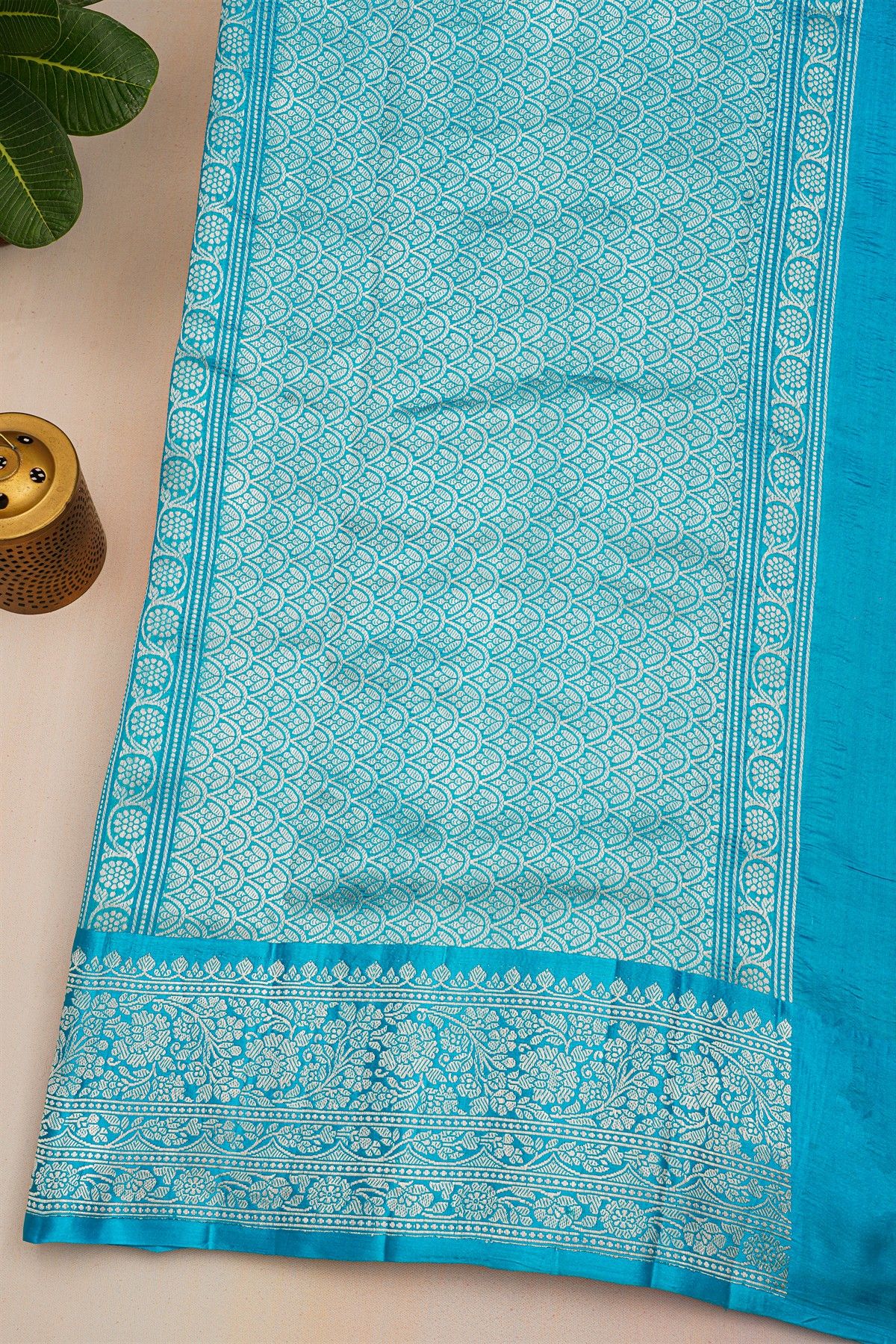 Fancy Matka Silk Rama Blue Saree With Buttis With Zari Lines Body And Self Florals And Leaves Jaal Border