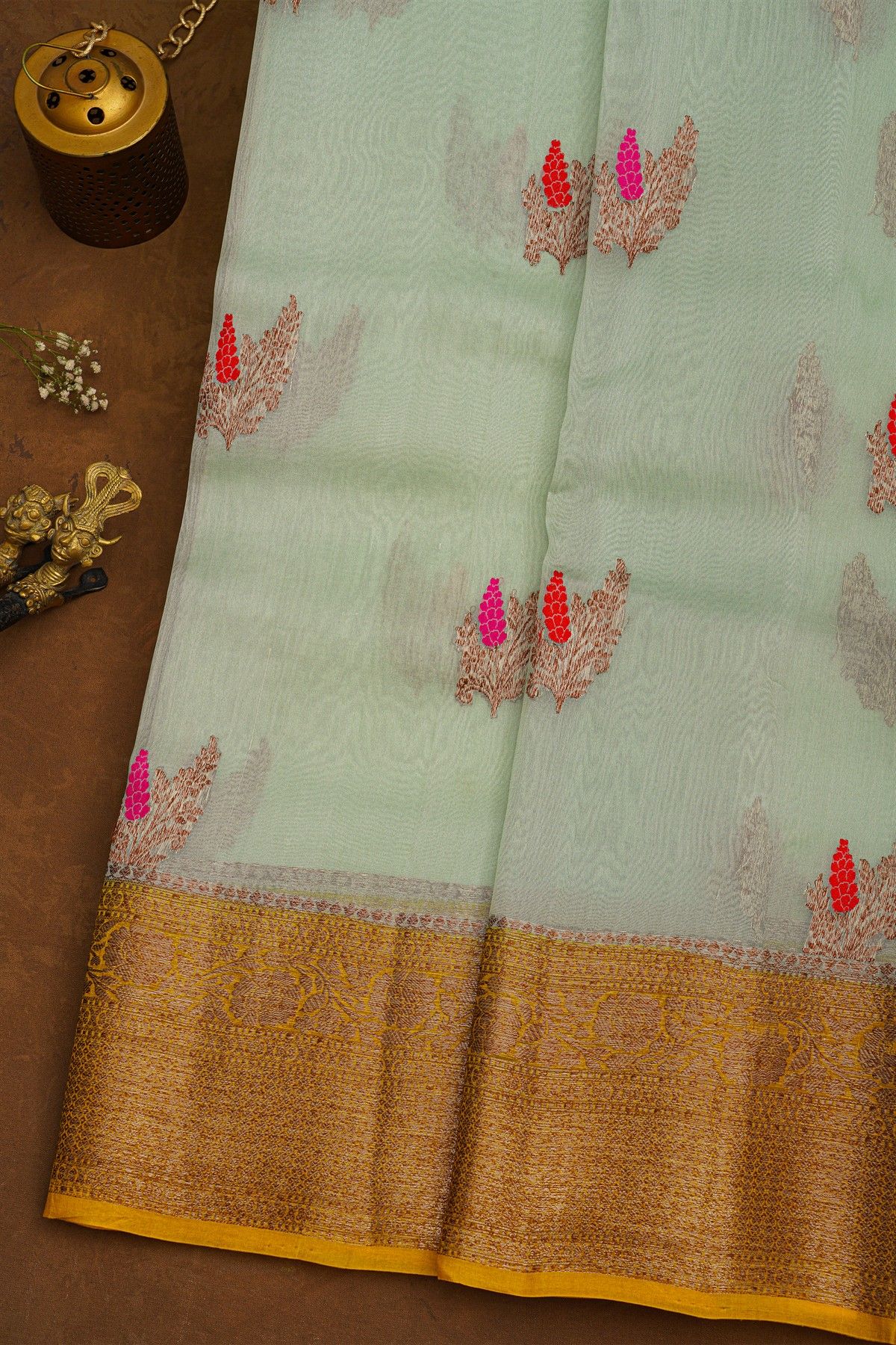 Fancy Organza Sea Green Saree With Florals And Buttis Body And Contrast Florals And Leaves Jaal With Kaddi Border