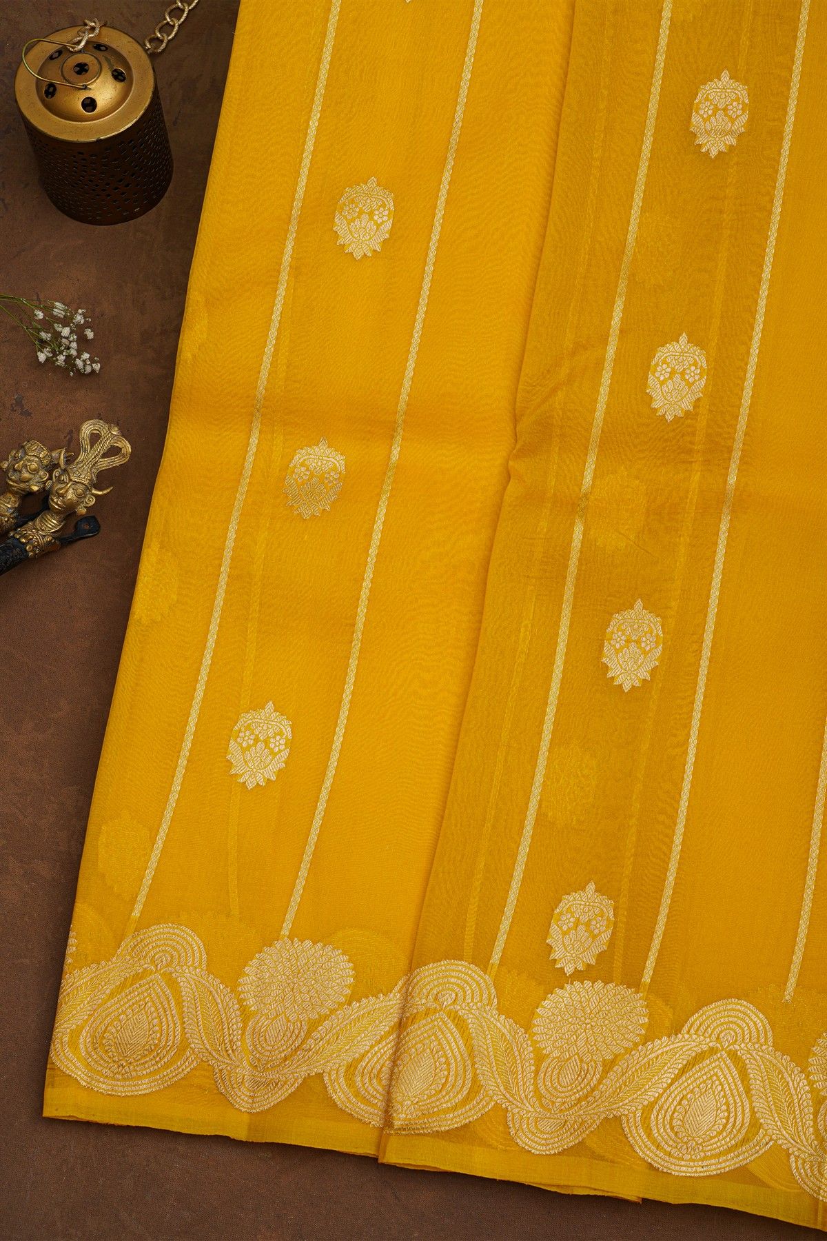 Fancy Organza Yellow Saree With Florals And Buttis Body And Self Florals And Leaves Border