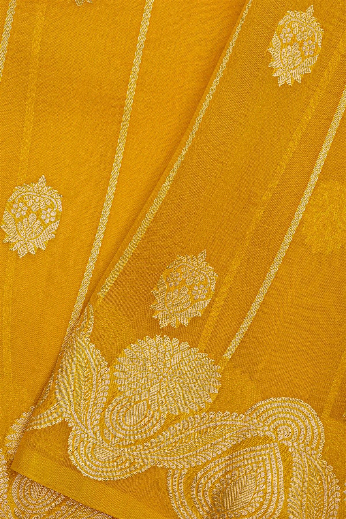 Fancy Organza Yellow Saree With Florals And Buttis Body And Self Florals And Leaves Border