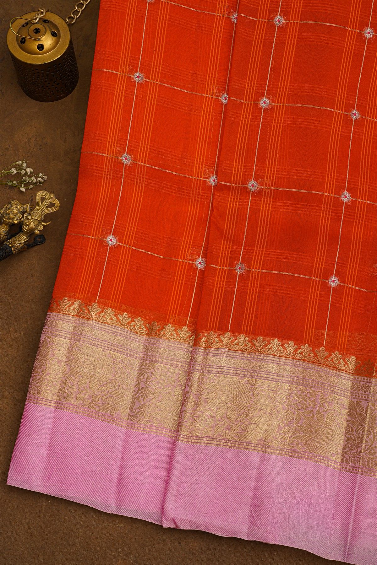 Fancy Organza Orange Saree With Checks And Buttis Body And Contrast Florals And Leaves Border