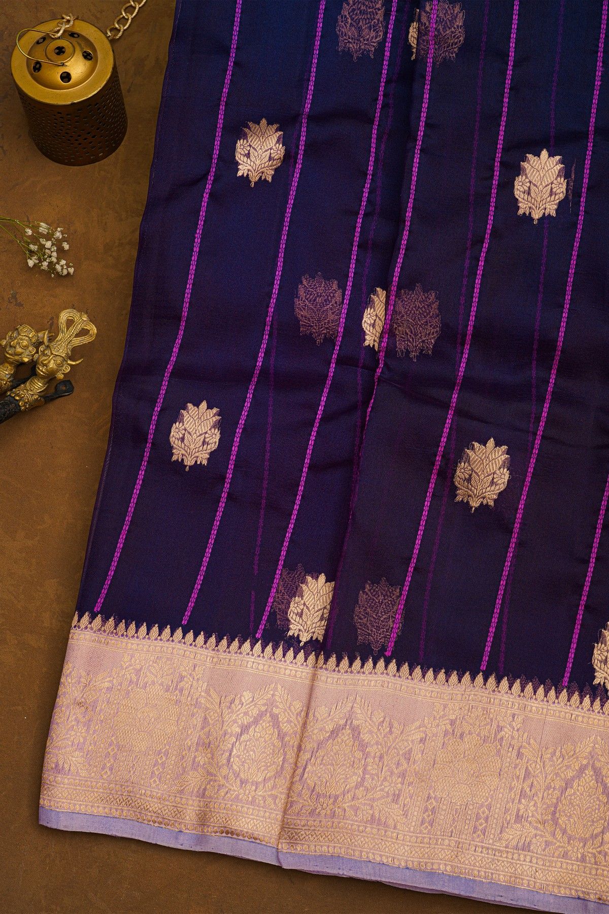 Fancy Organza Purple Saree With Zari Lines And Buttis Body And Contrast Florals And Leaves Border