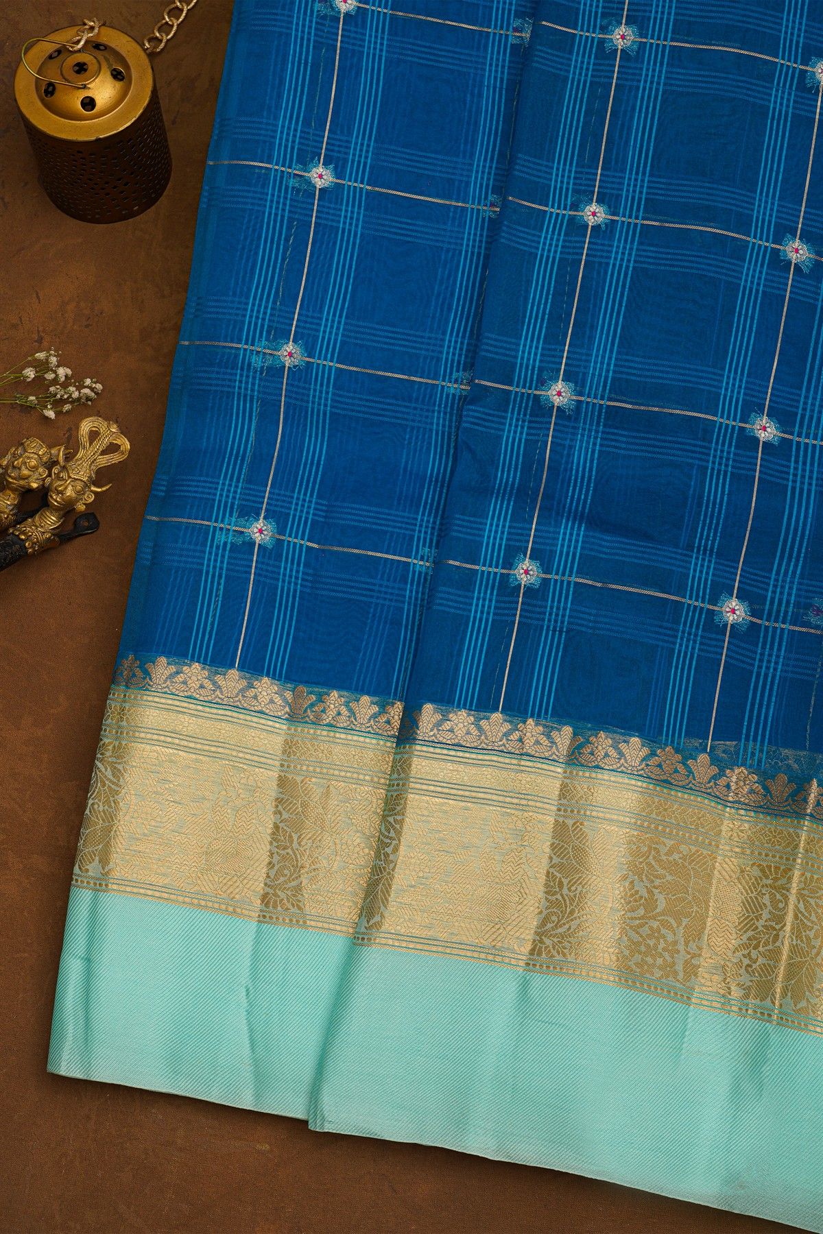 Fancy Organza Royal Blue Saree With Checks And Florals Body And Contrast Florals And Leaves Border