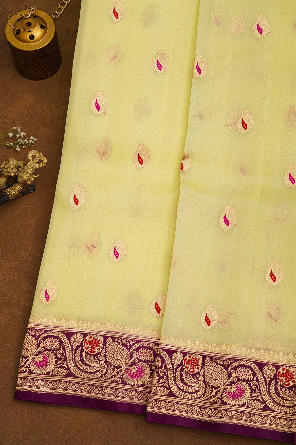 Fancy Organza Off White Saree With Florals And Buttis Body And Contrast Florals And Leaves Border