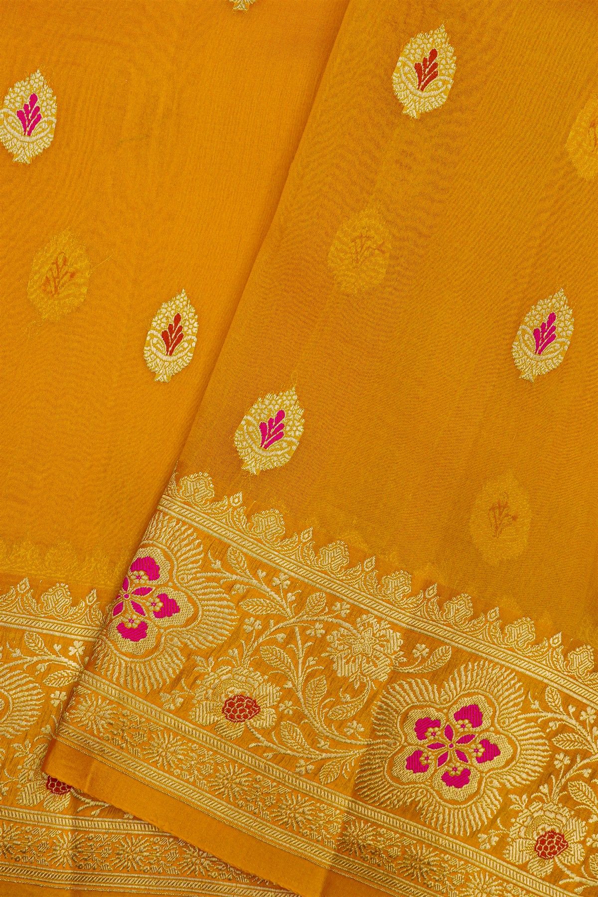 Fancy Organza Mustard Saree With Florals And Buttis Body And Self Florals And Leaves Jaal Border