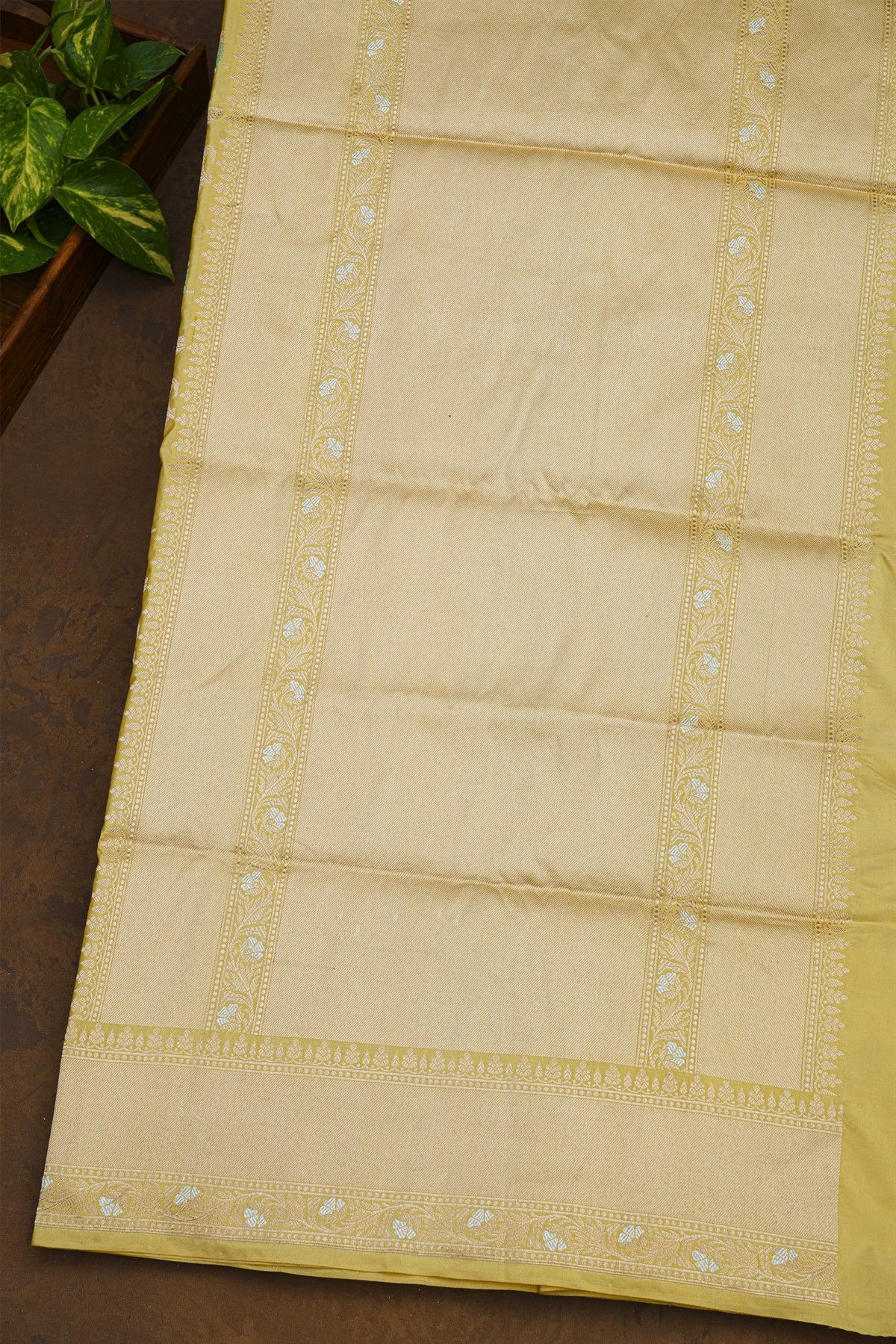 Banarasi Silk Pale Yellow Saree With Cross Lines Florals And Jaal Border
