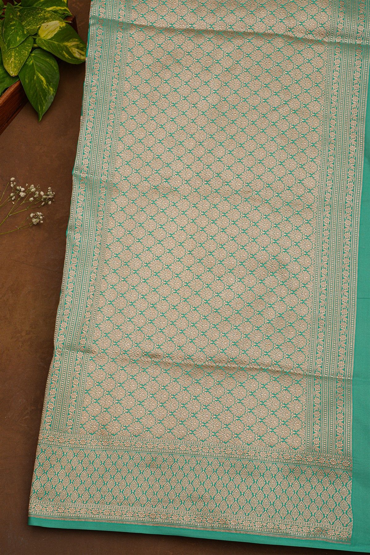Banarasi Silk Sea Green Saree With Florals And Leaves Border