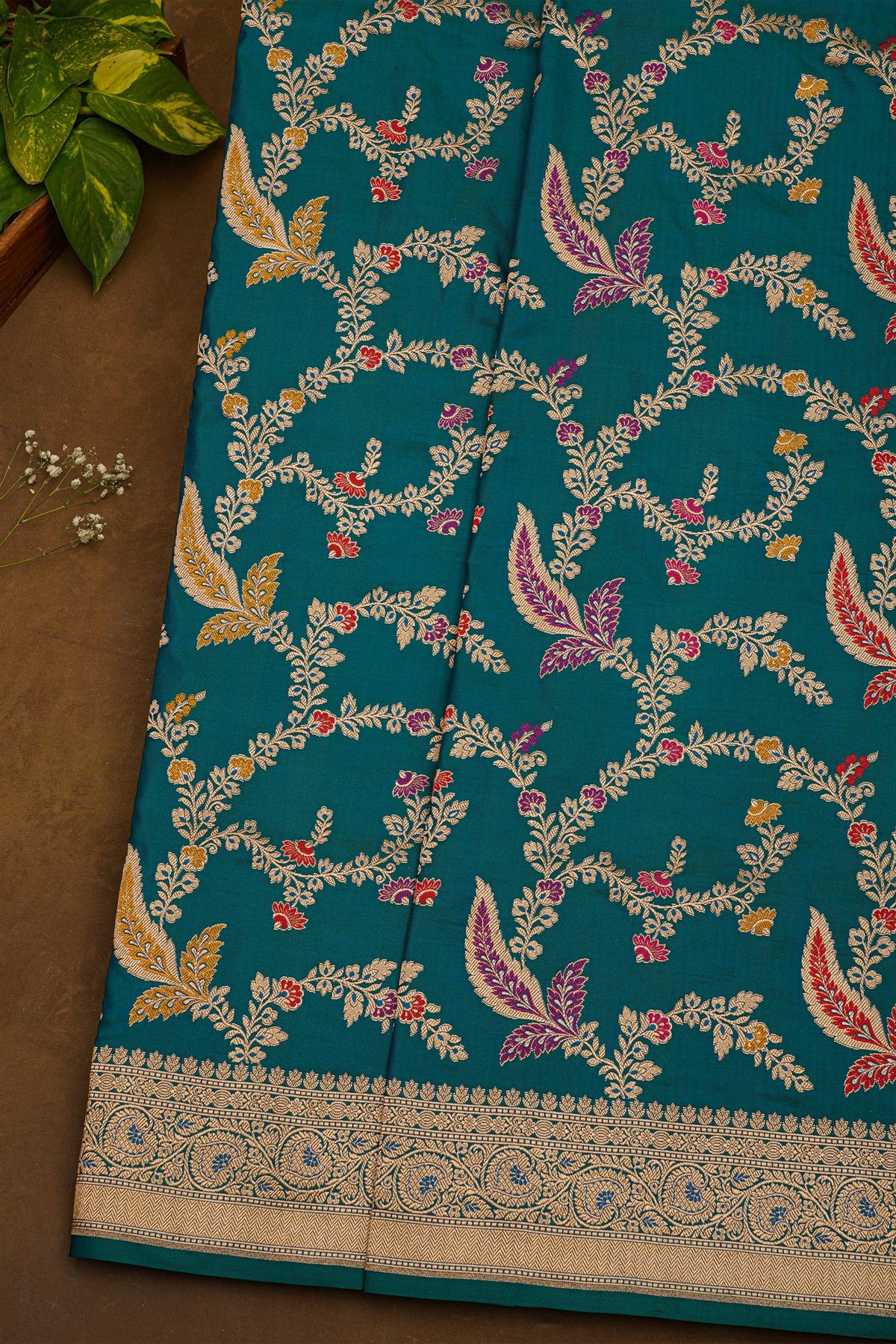 Banarasi Silk Peacock Blue Saree With Florals And Leaves Jaal Border