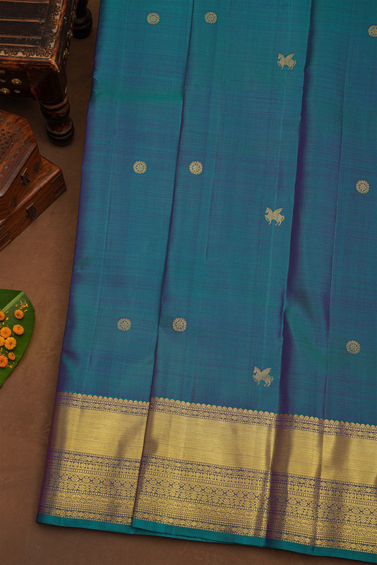 Kancheepuram Pure Silk Teal Blue Saree With Body Florals And Leaves Jaal With Zari Border