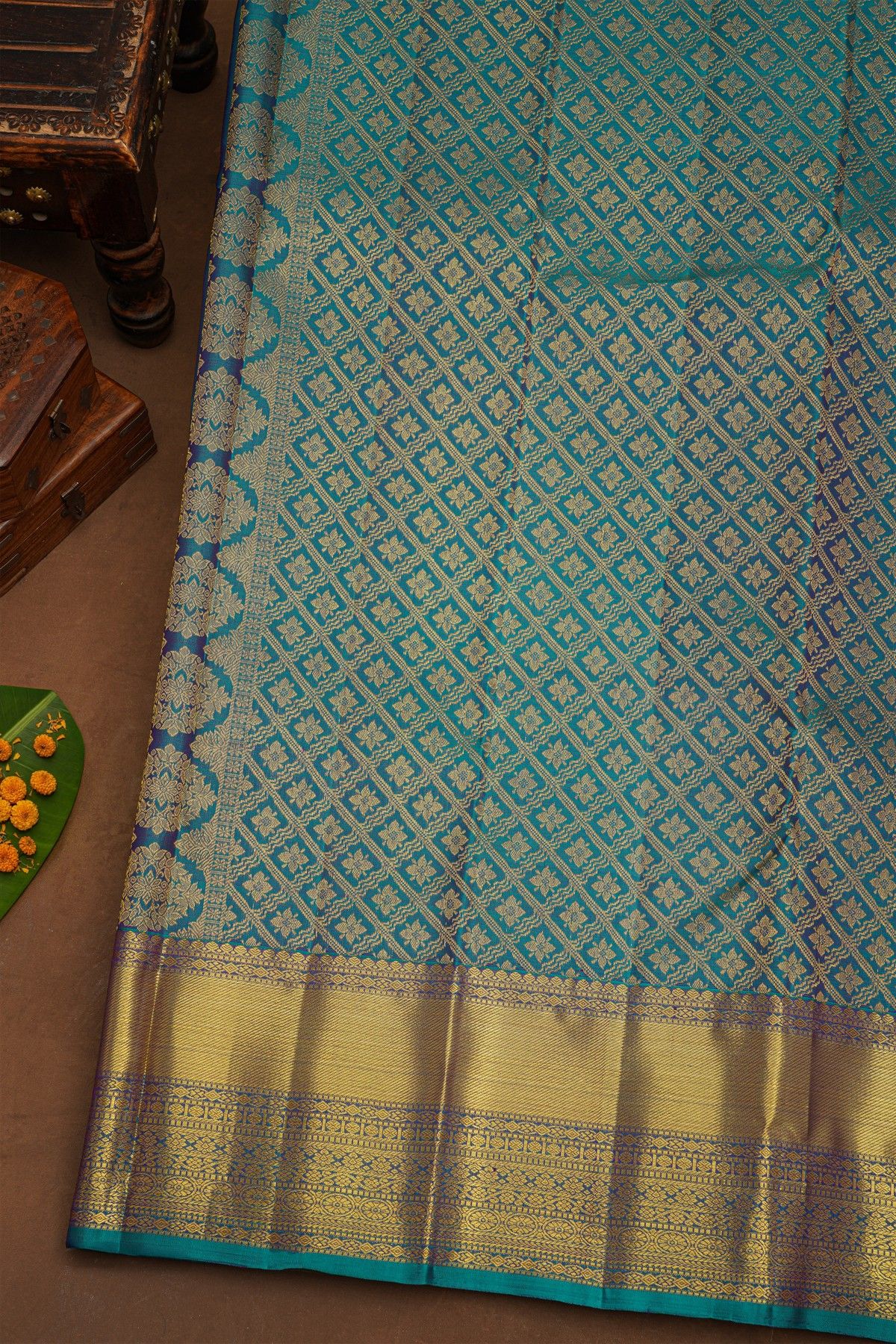 Kancheepuram Pure Silk Teal Blue Saree With Body Florals And Leaves Jaal With Zari Border