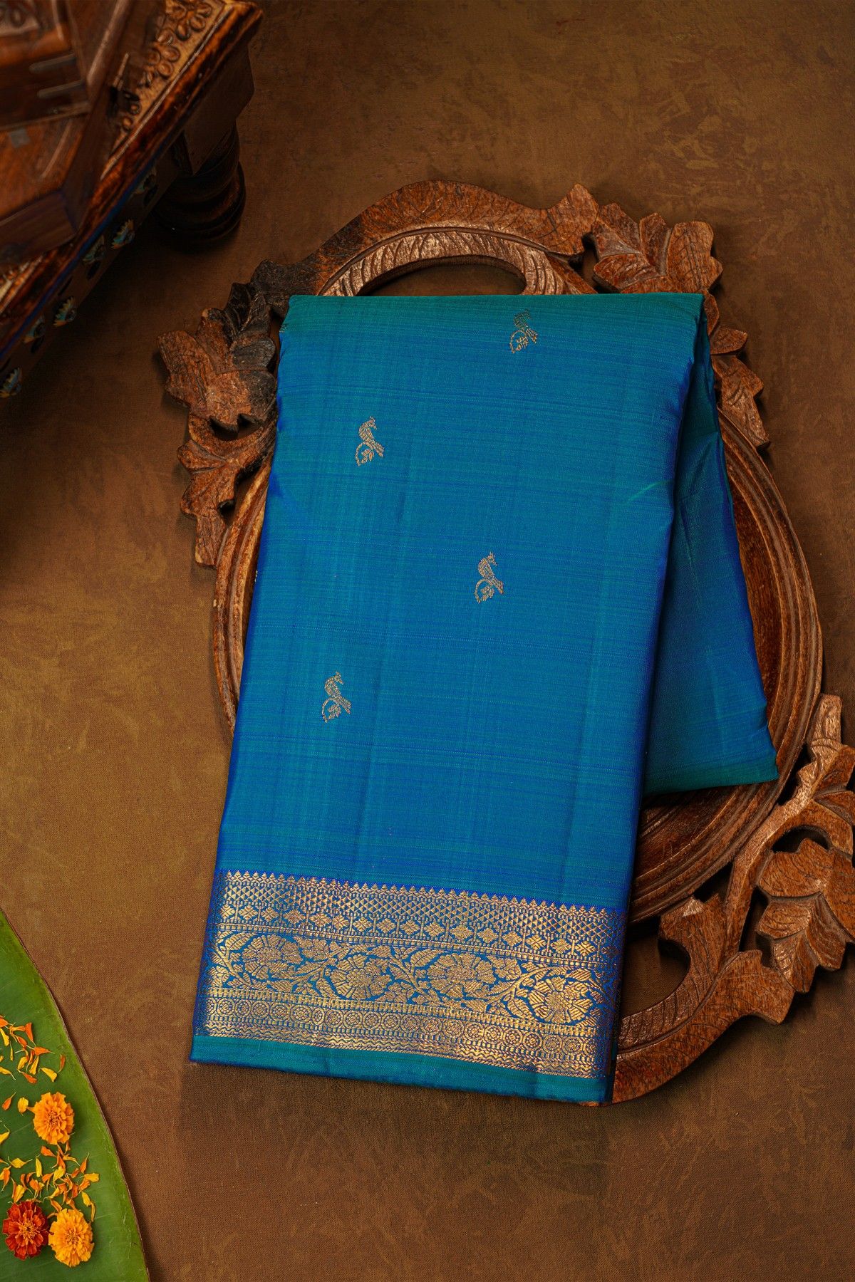 Kancheepuram Pure Silk Sky Blue Saree With Florals And Leaves With Peacocks Border