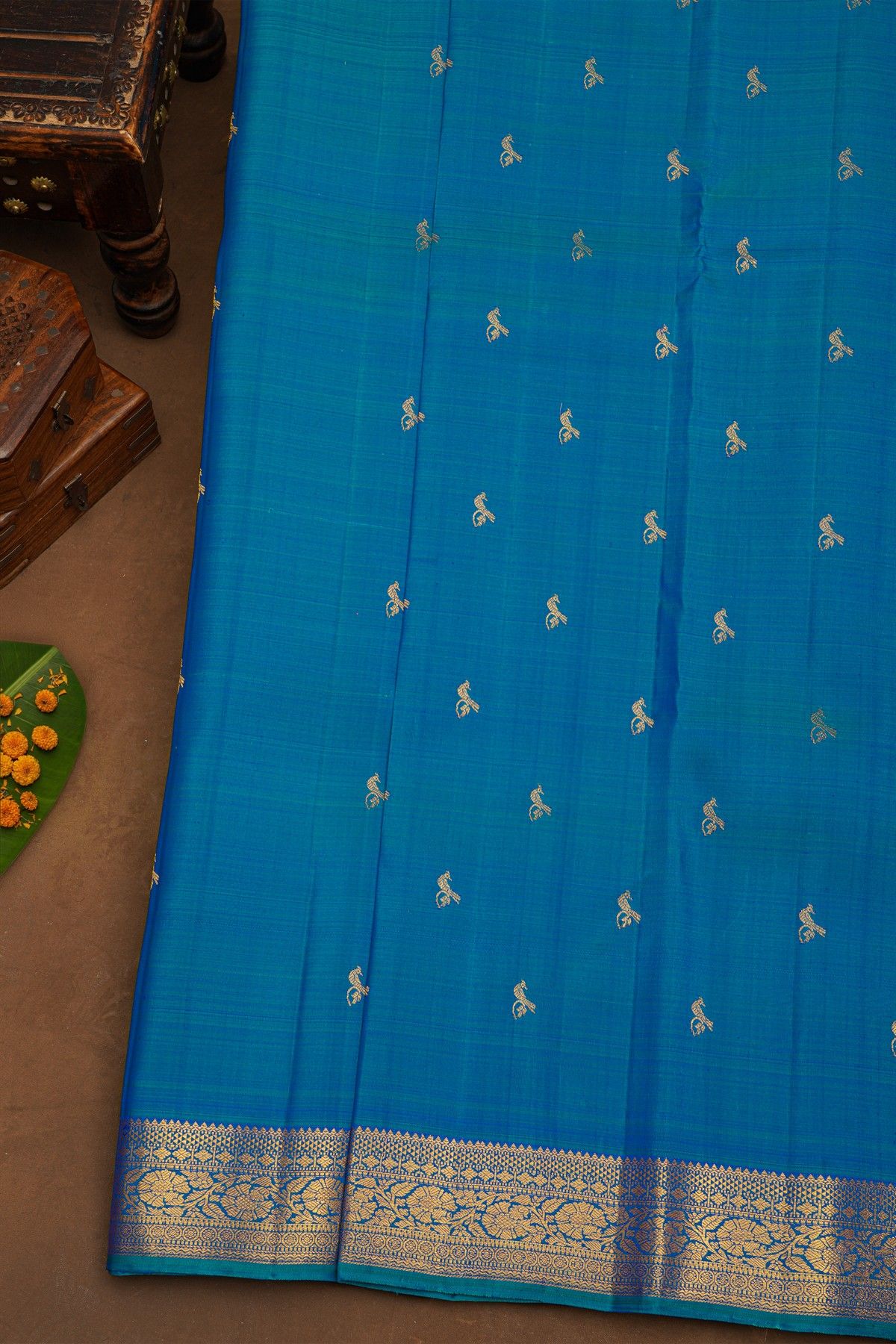 Kancheepuram Pure Silk Sky Blue Saree With Florals And Leaves With Peacocks Border