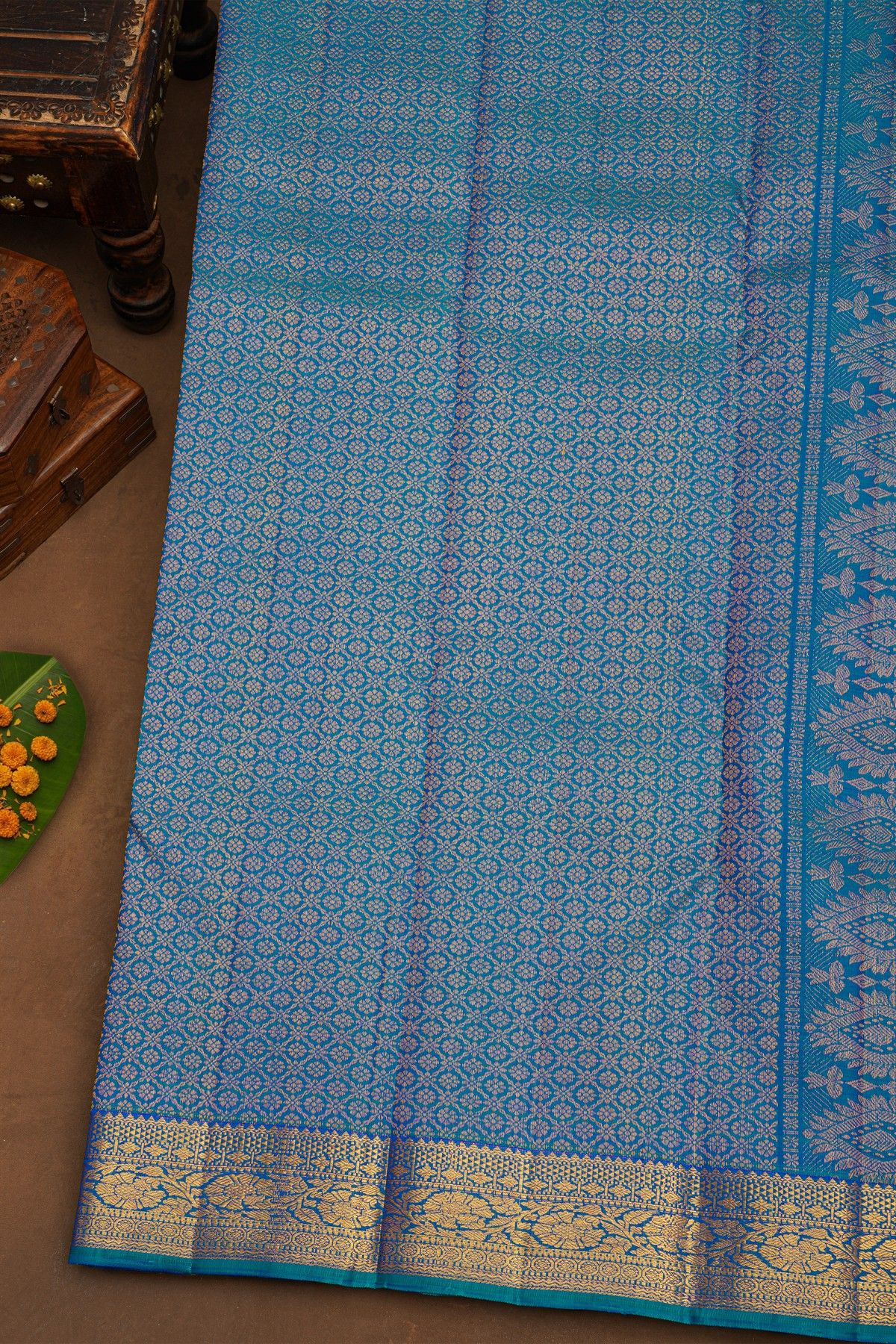 Kancheepuram Pure Silk Sky Blue Saree With Florals And Leaves With Peacocks Border