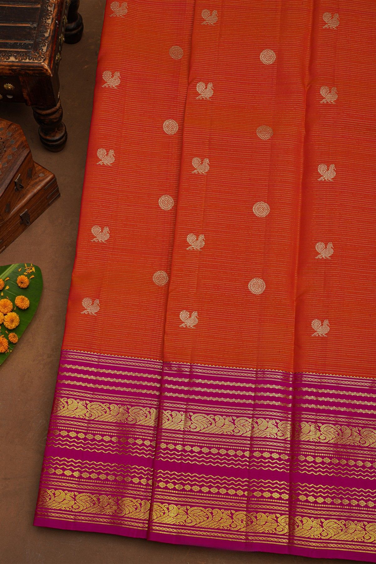 Kancheepuram Pure Silk Orange Saree With Florals And Peacocks Border