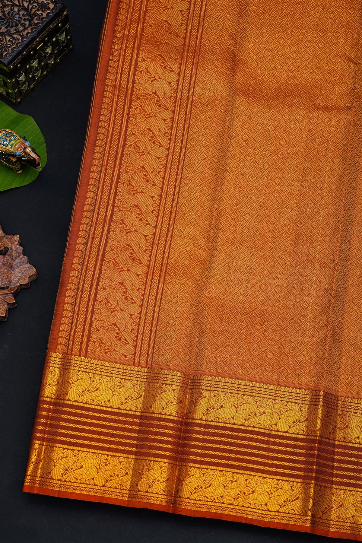 Kancheepuram Silk Brown Saree With Florals And Peacocks With Zari Lines Border