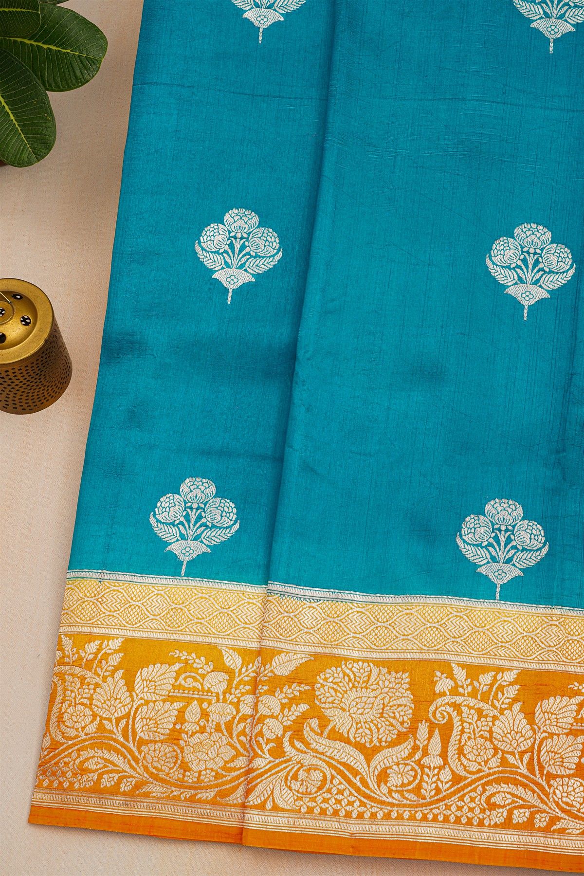 Fancy Matka Silk Peacock Blue Saree With Florals And Buttis Body And Contrast Florals And Leaves Jaal Border