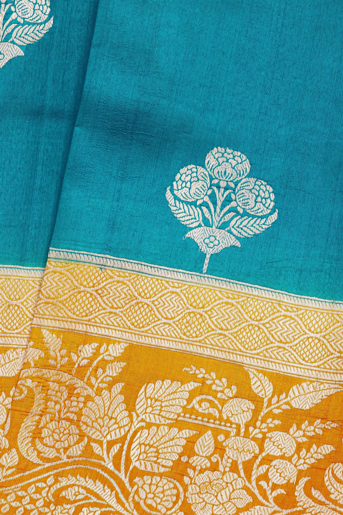 Fancy Matka Silk Peacock Blue Saree With Florals And Buttis Body And Contrast Florals And Leaves Jaal Border