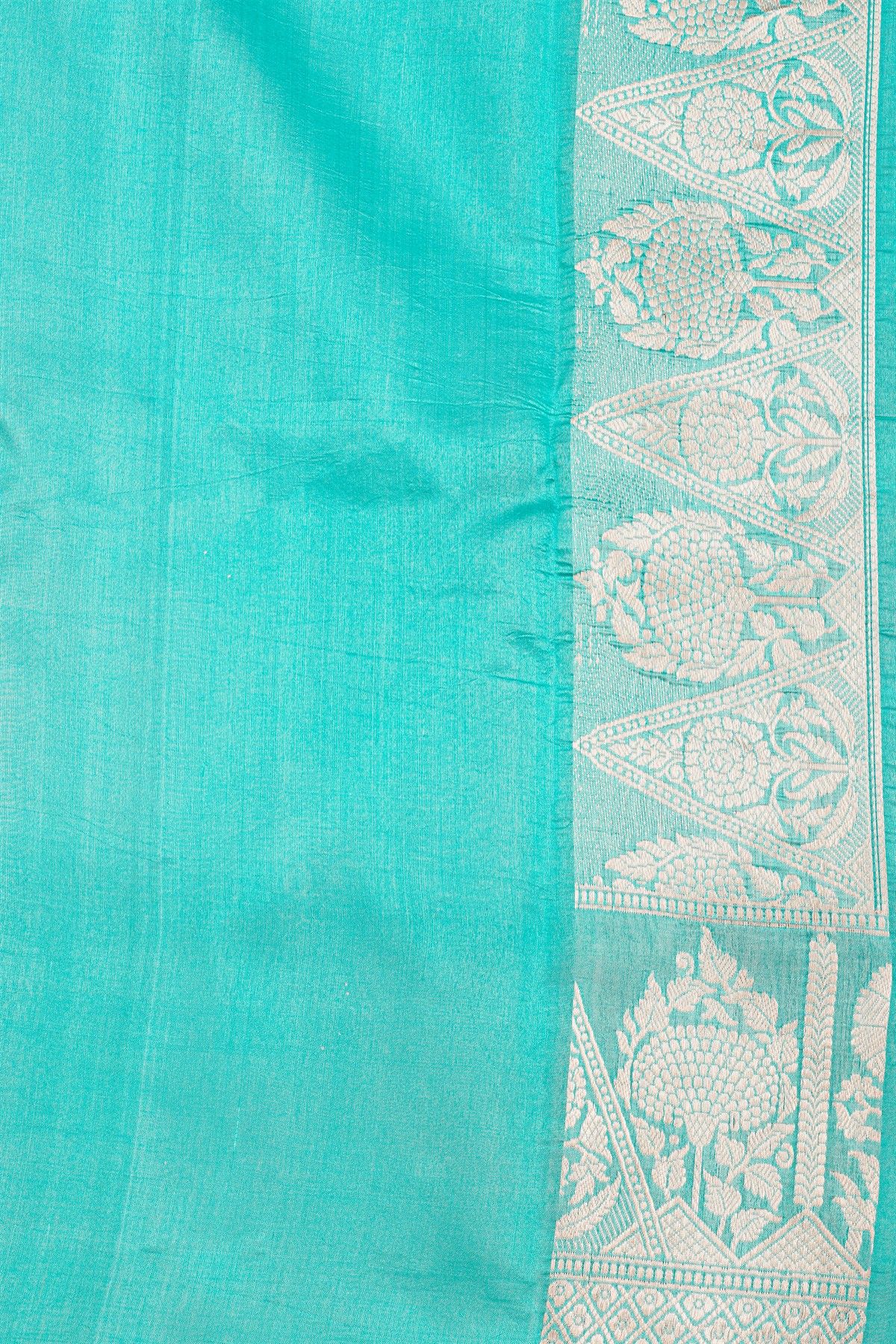 Fancy Matka Silk Peacock Blue Saree With Florals And Buttis Body And Contrast Florals And Leaves Border