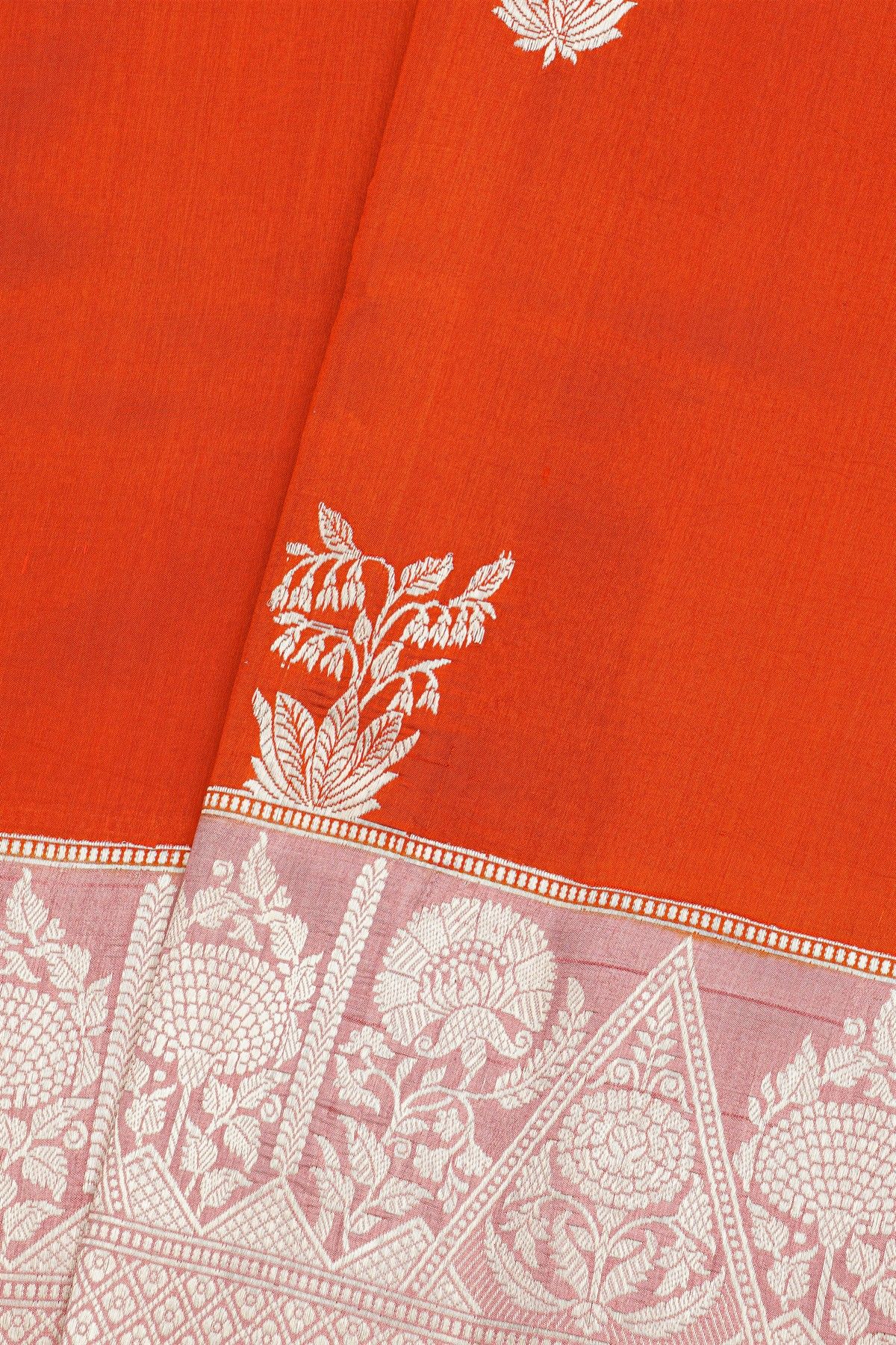 Fancy Matka Silk Orange Saree With Florals And Buttis Body And Contrast Florals And Leaves Border